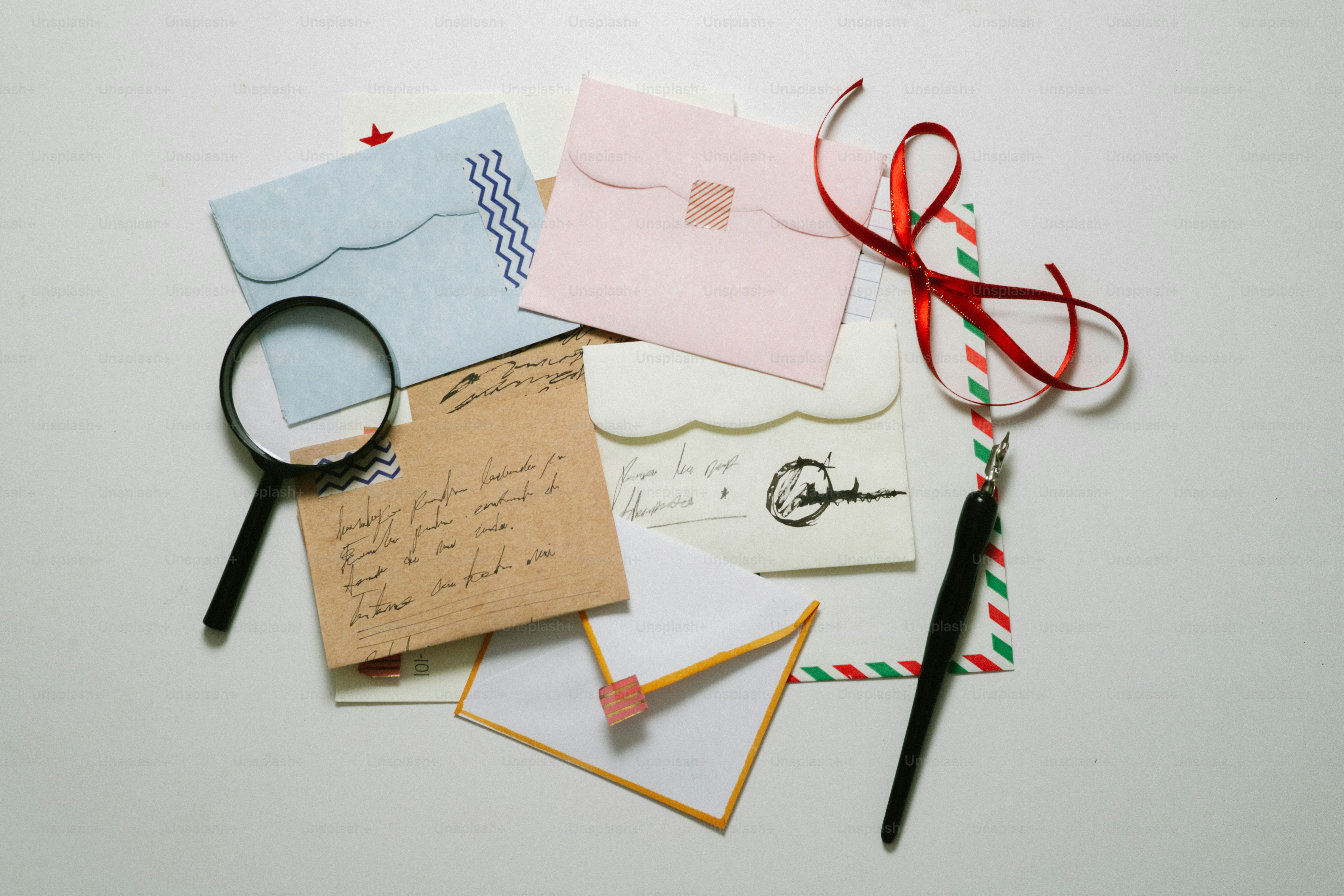 Handwritten notes in envelopes on red background. photo – Paper Image ...