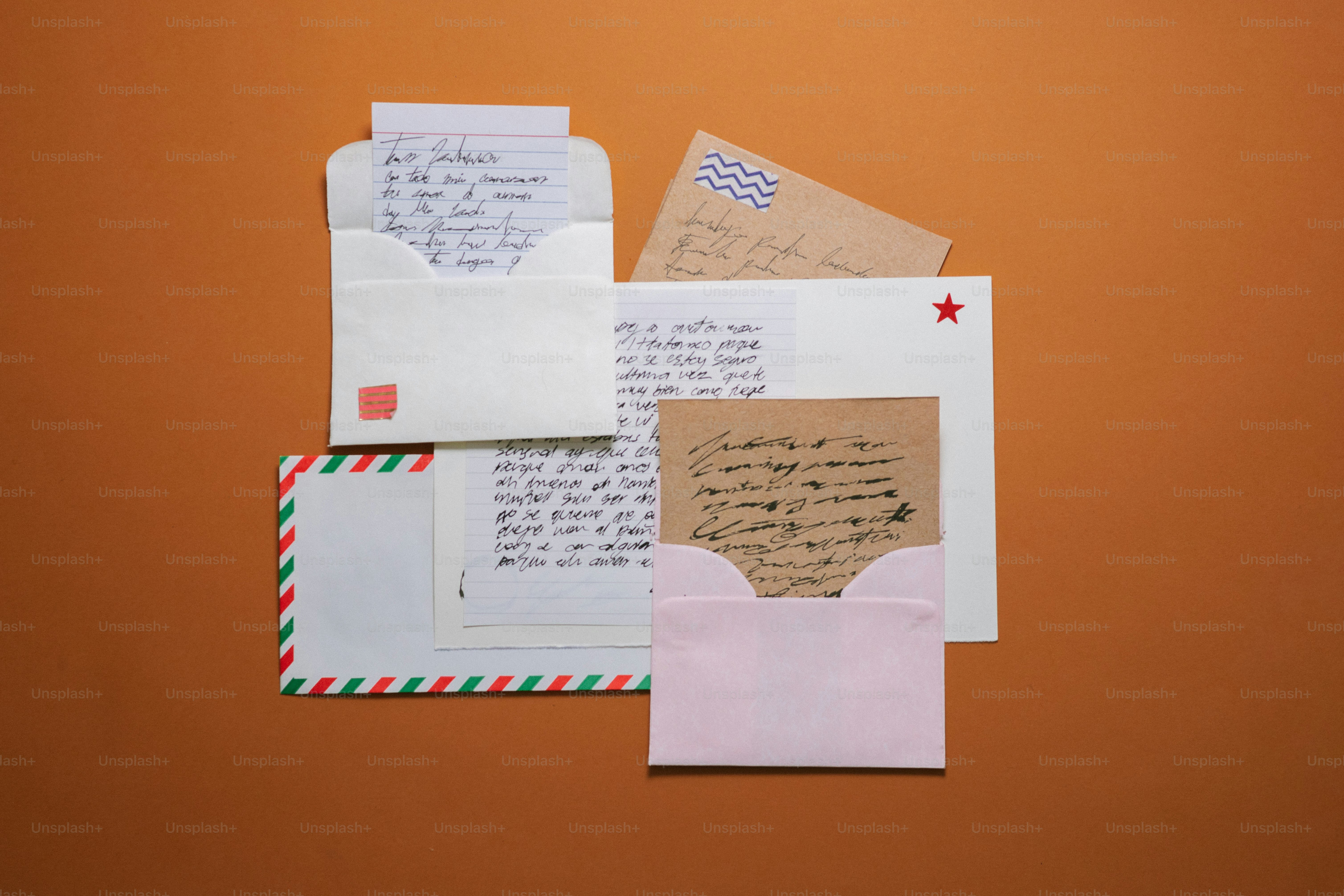 Several letters and envelopes arranged on a brown surface.