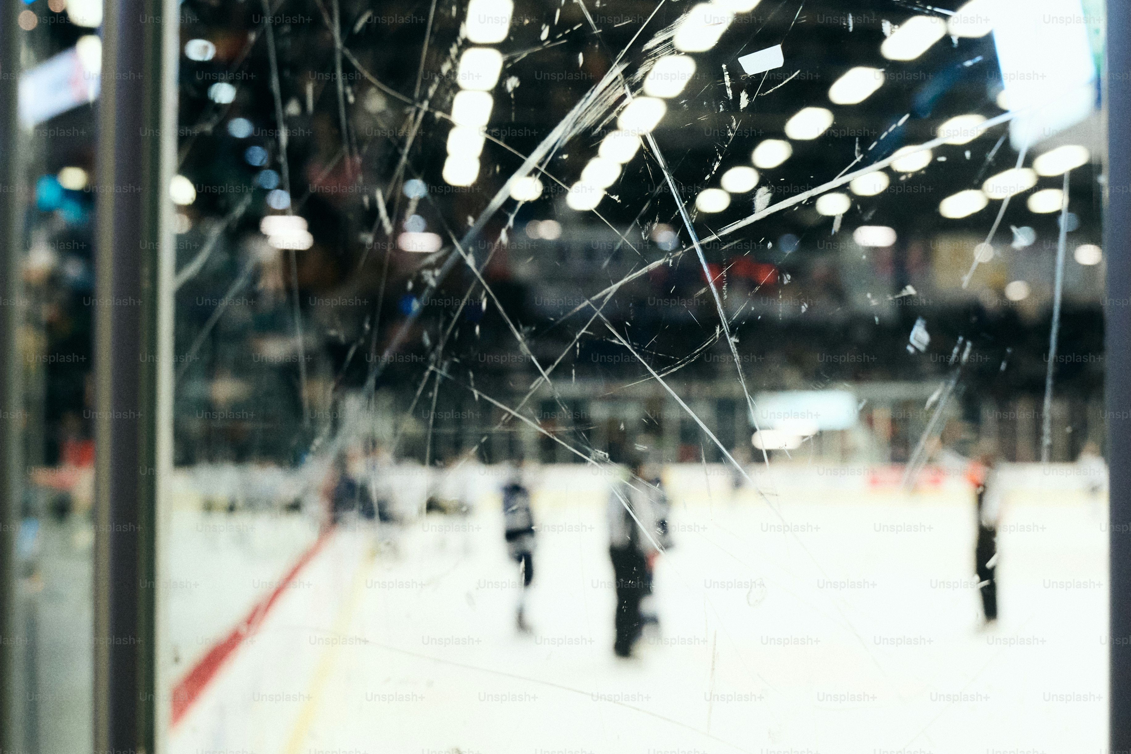 Hockey game viewed through scratched glass