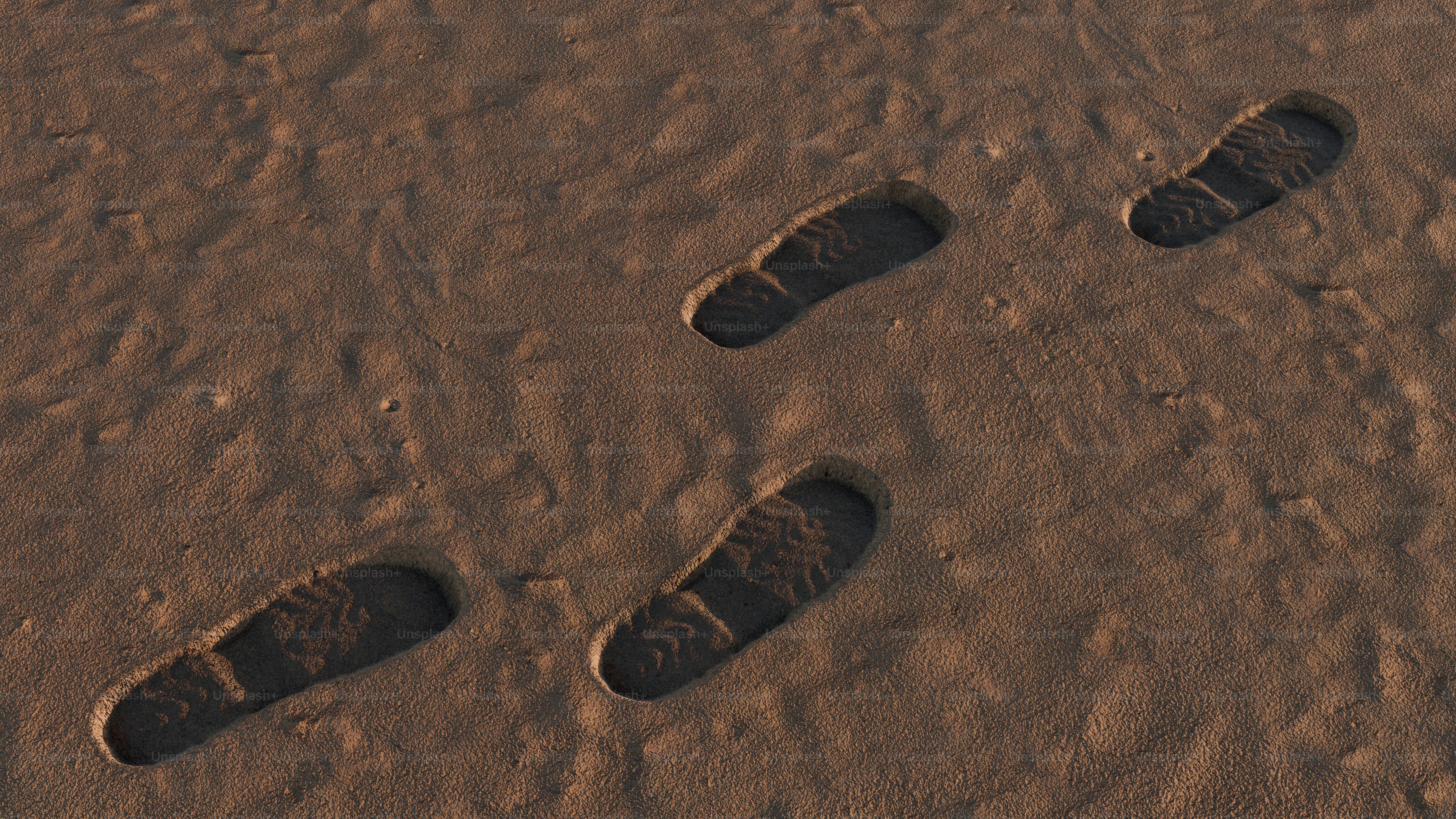 Pegadas na areia se afastando