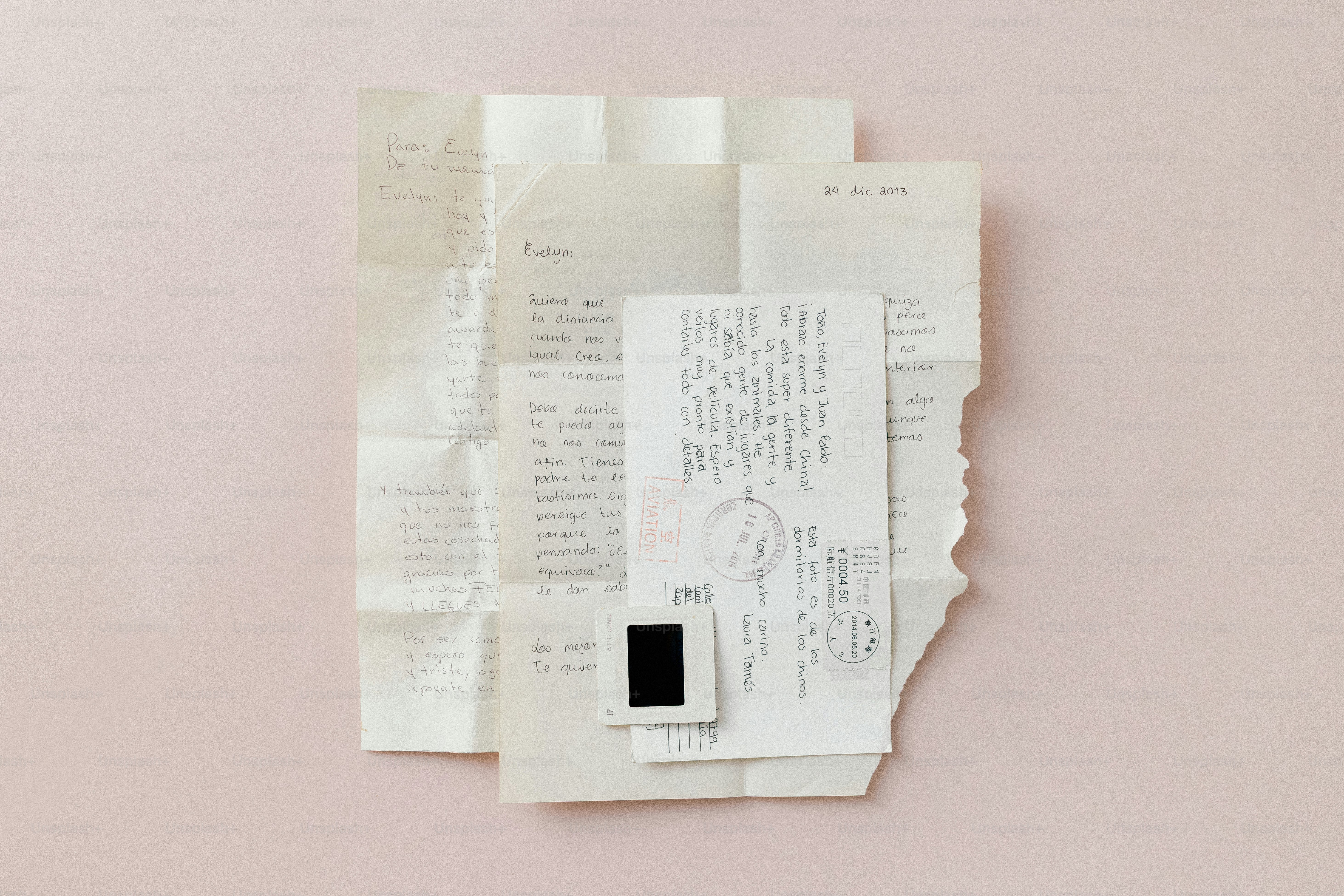 A stack of old, handwritten letters on pink background photo – Paper ...