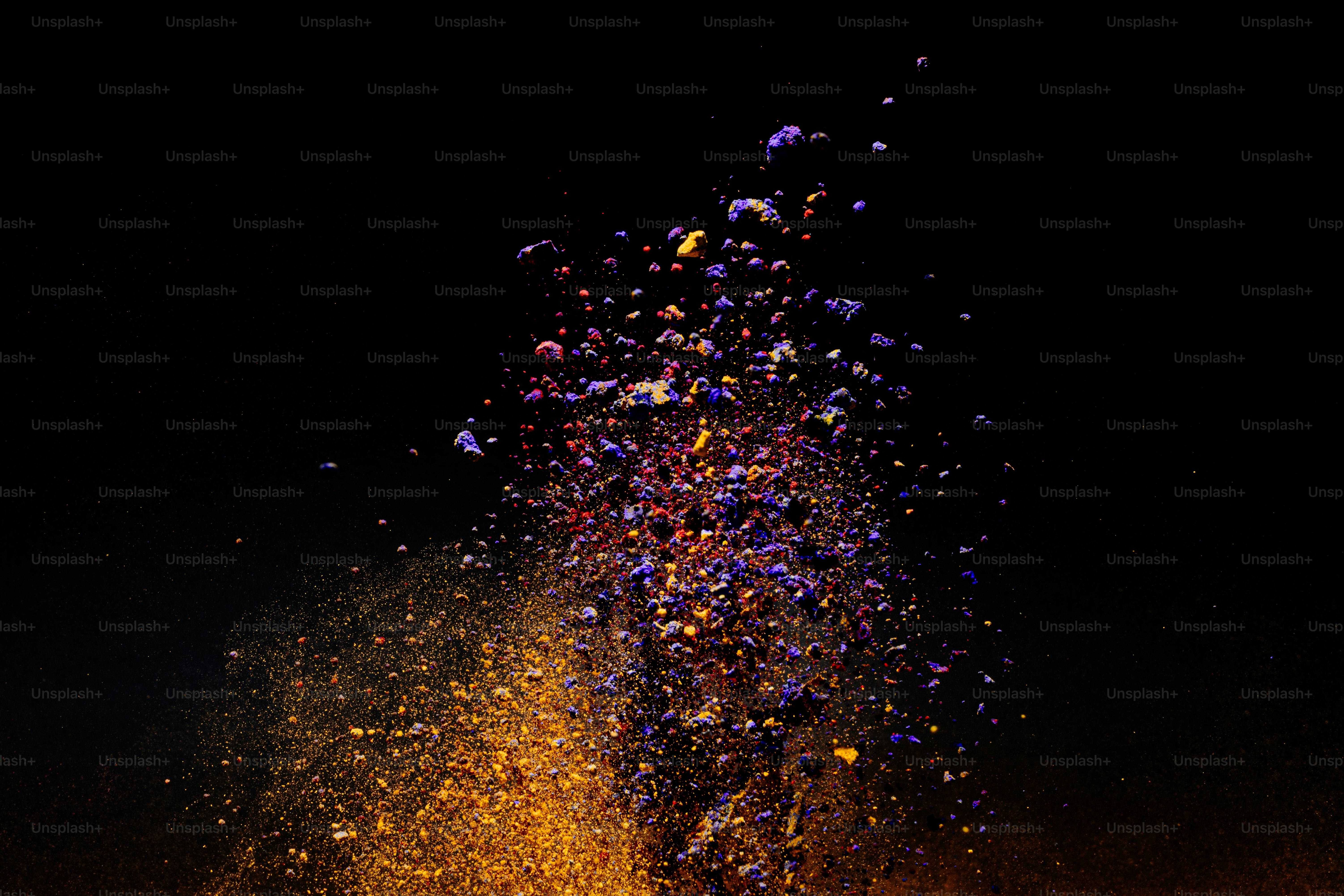 Explosion of colorful powder against a black background. photo ...