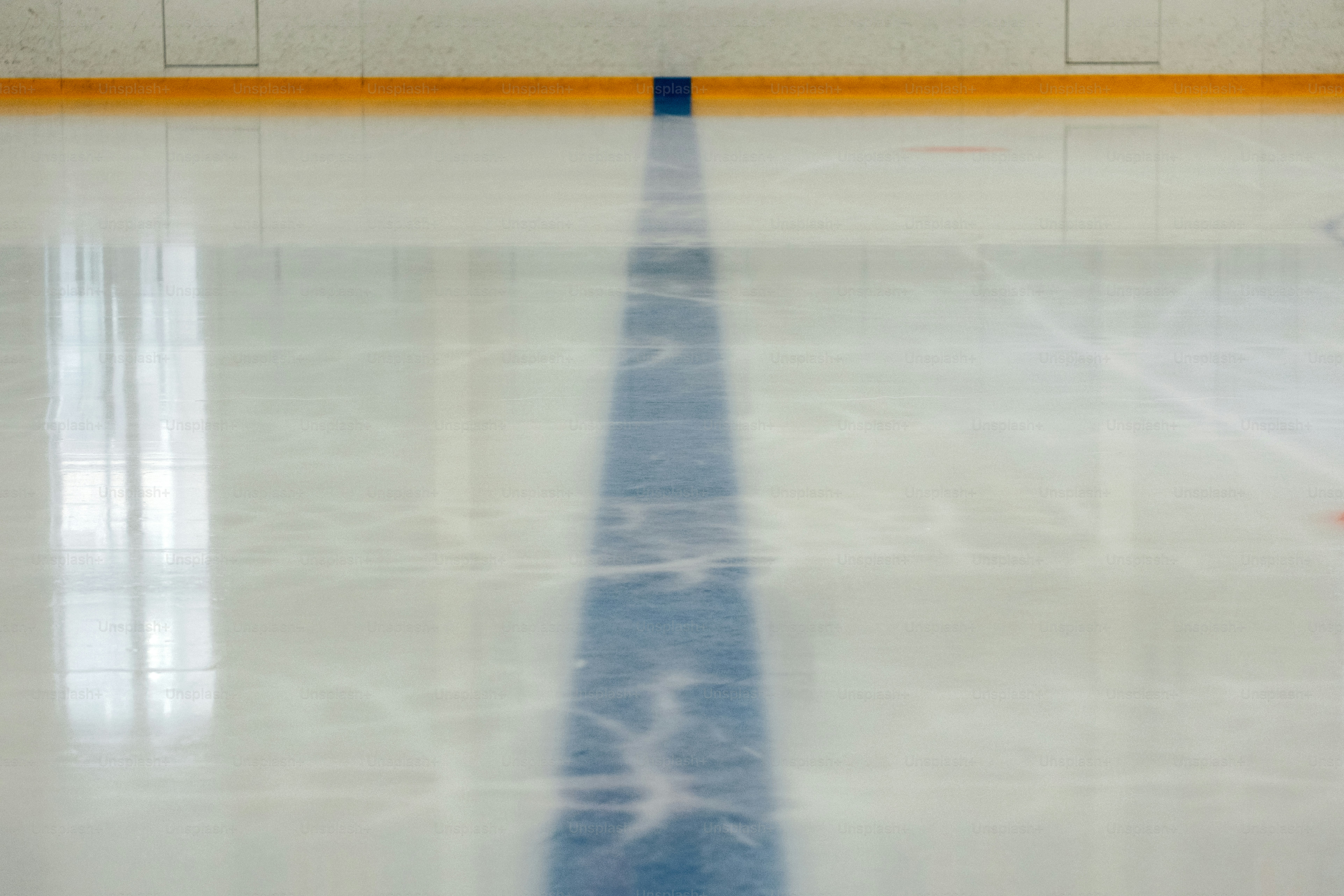 A zamboni resurfaces an ice rink with brushes. photo – Ice Image on ...