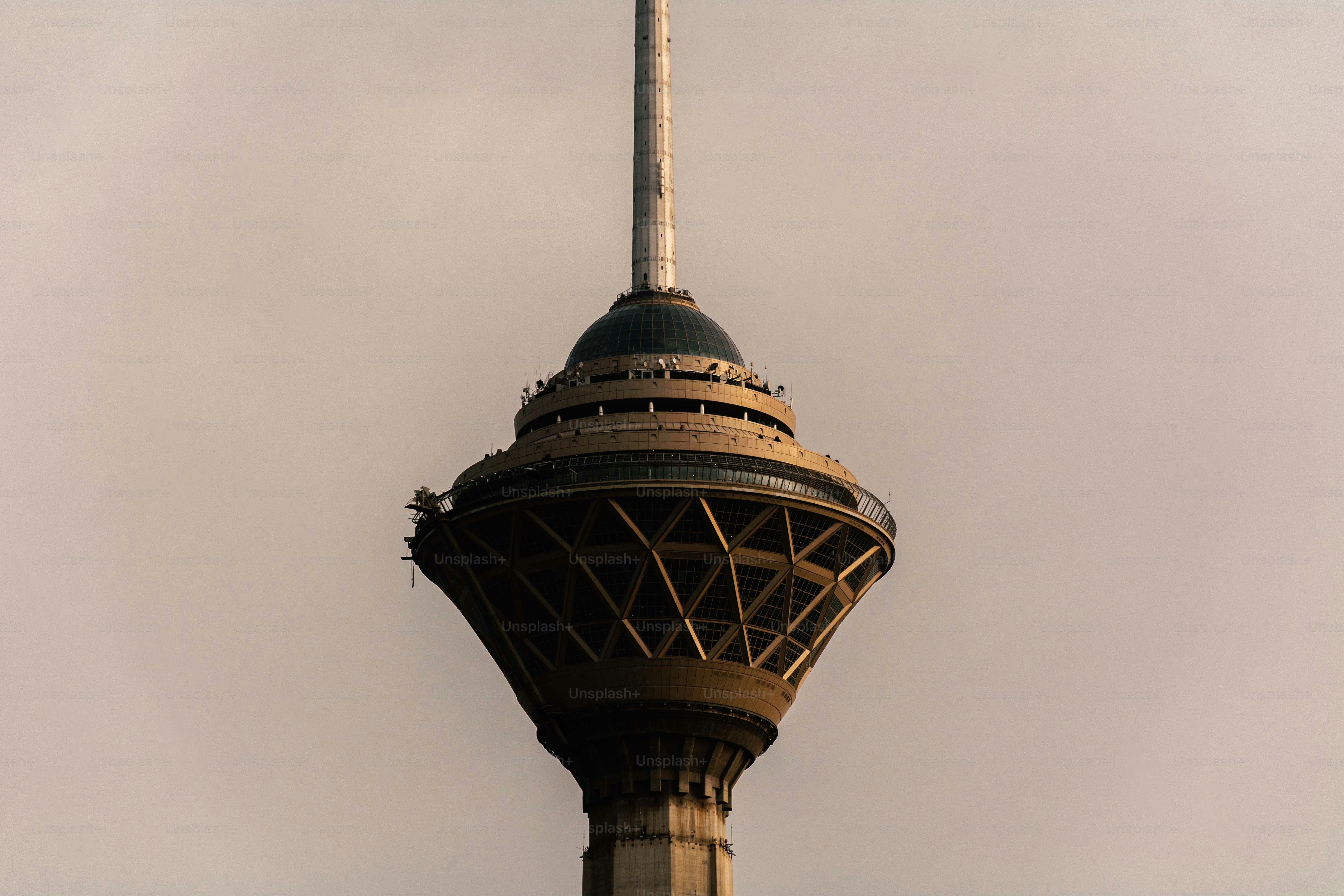 Close-up of a modern tower against a hazy sky