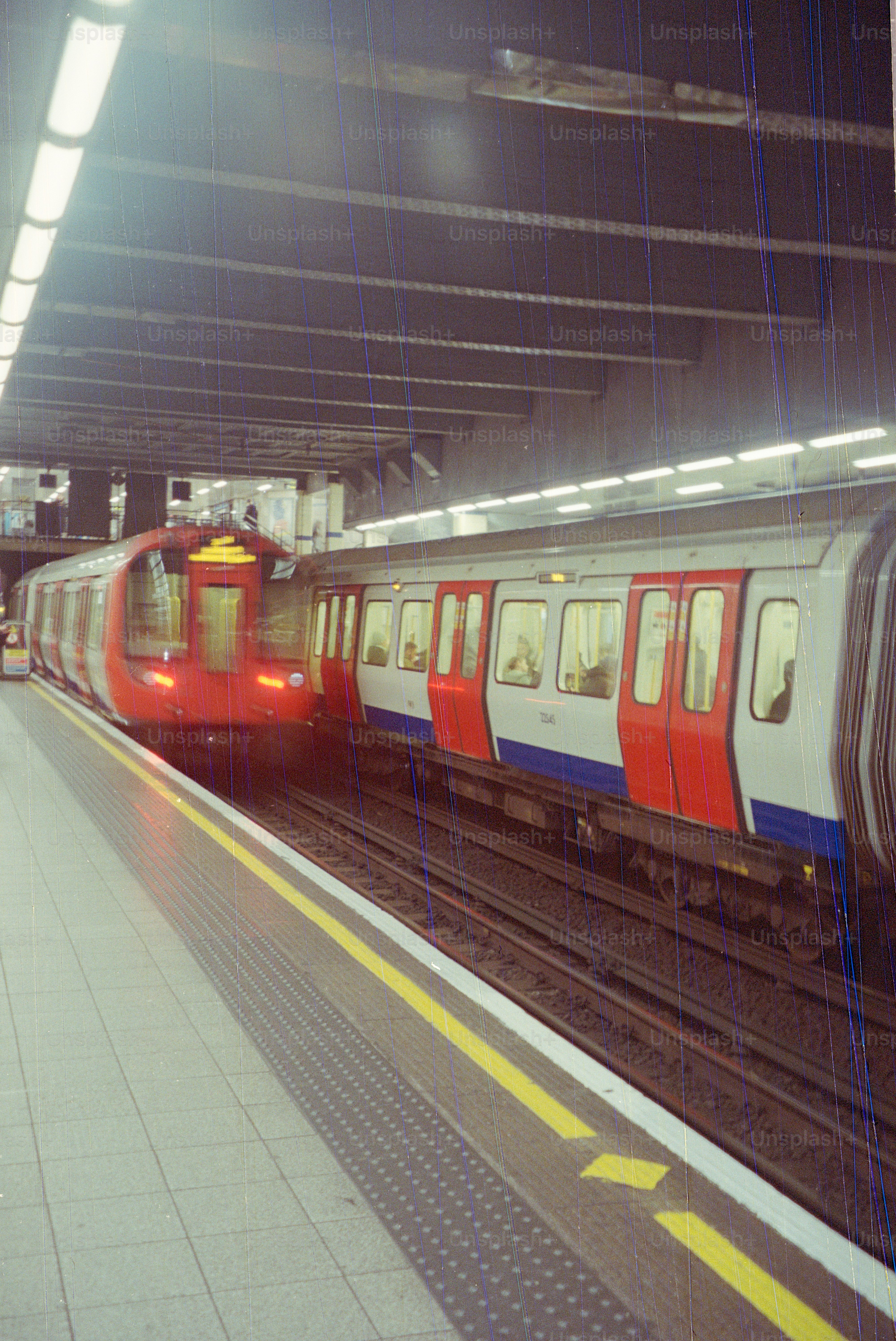 Two trains at a subway station platform