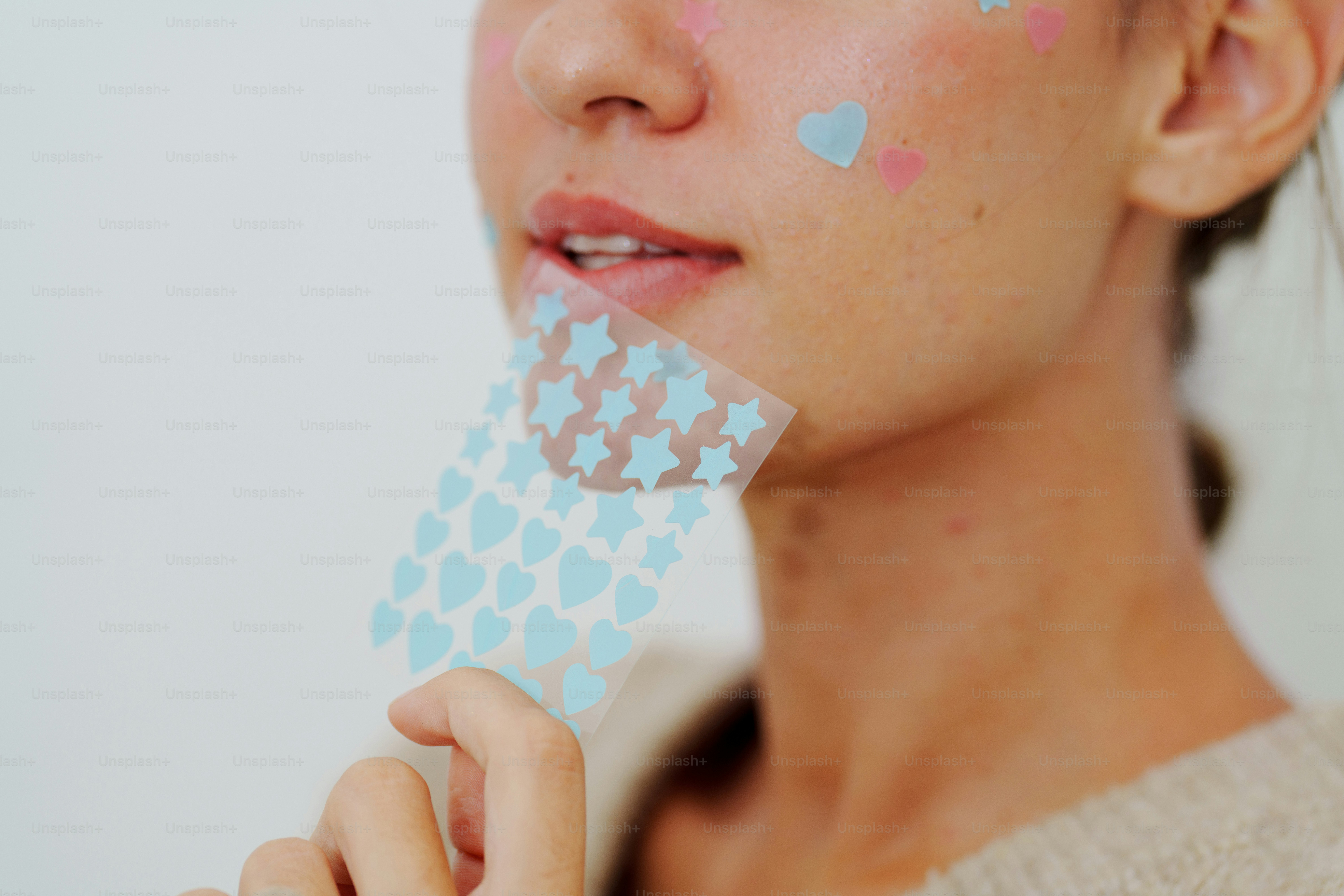Woman with smiley face stickers on her face photo – Portrait Image on ...