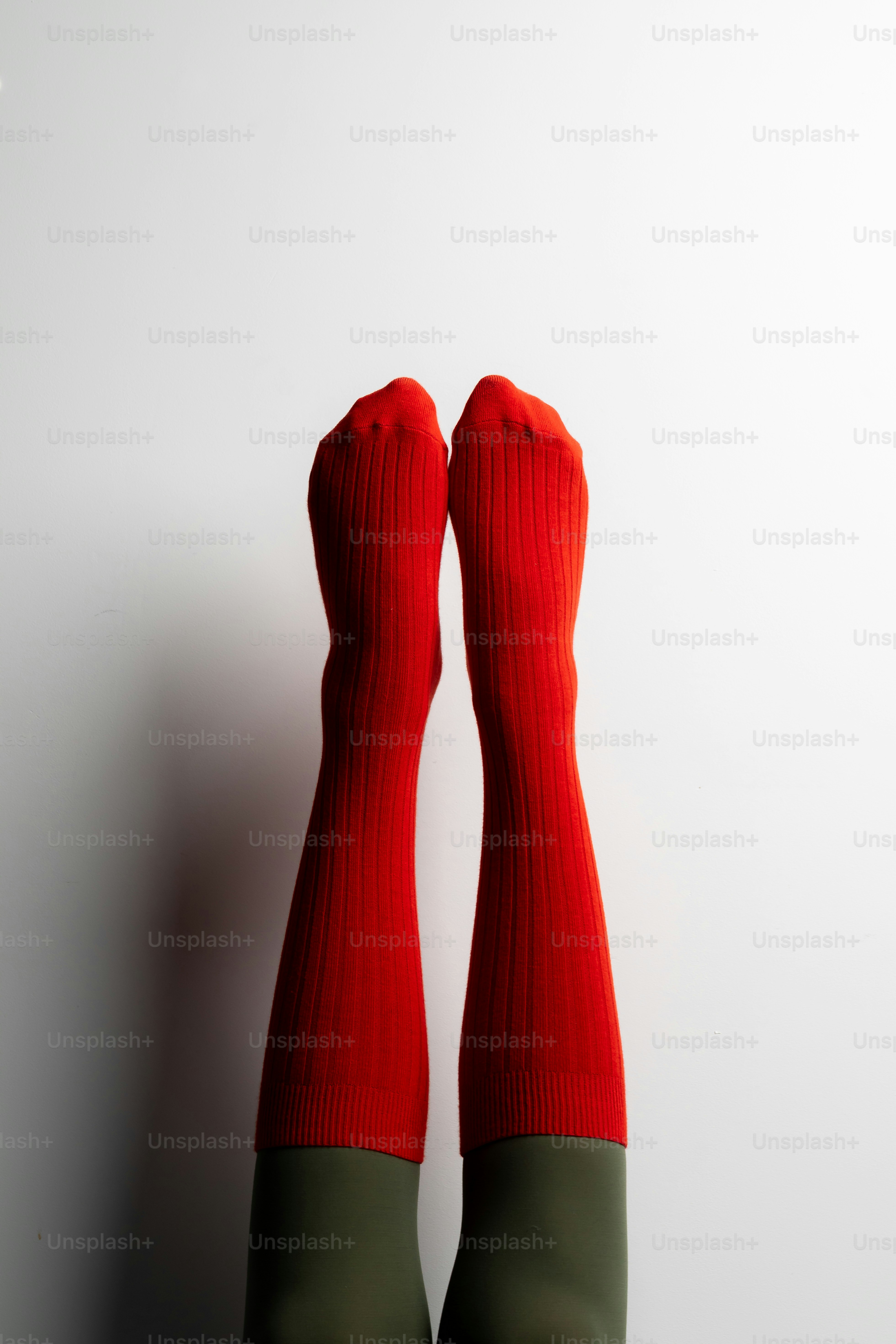 Pair of legs wearing red ribbed socks photo – Feet Image on Unsplash