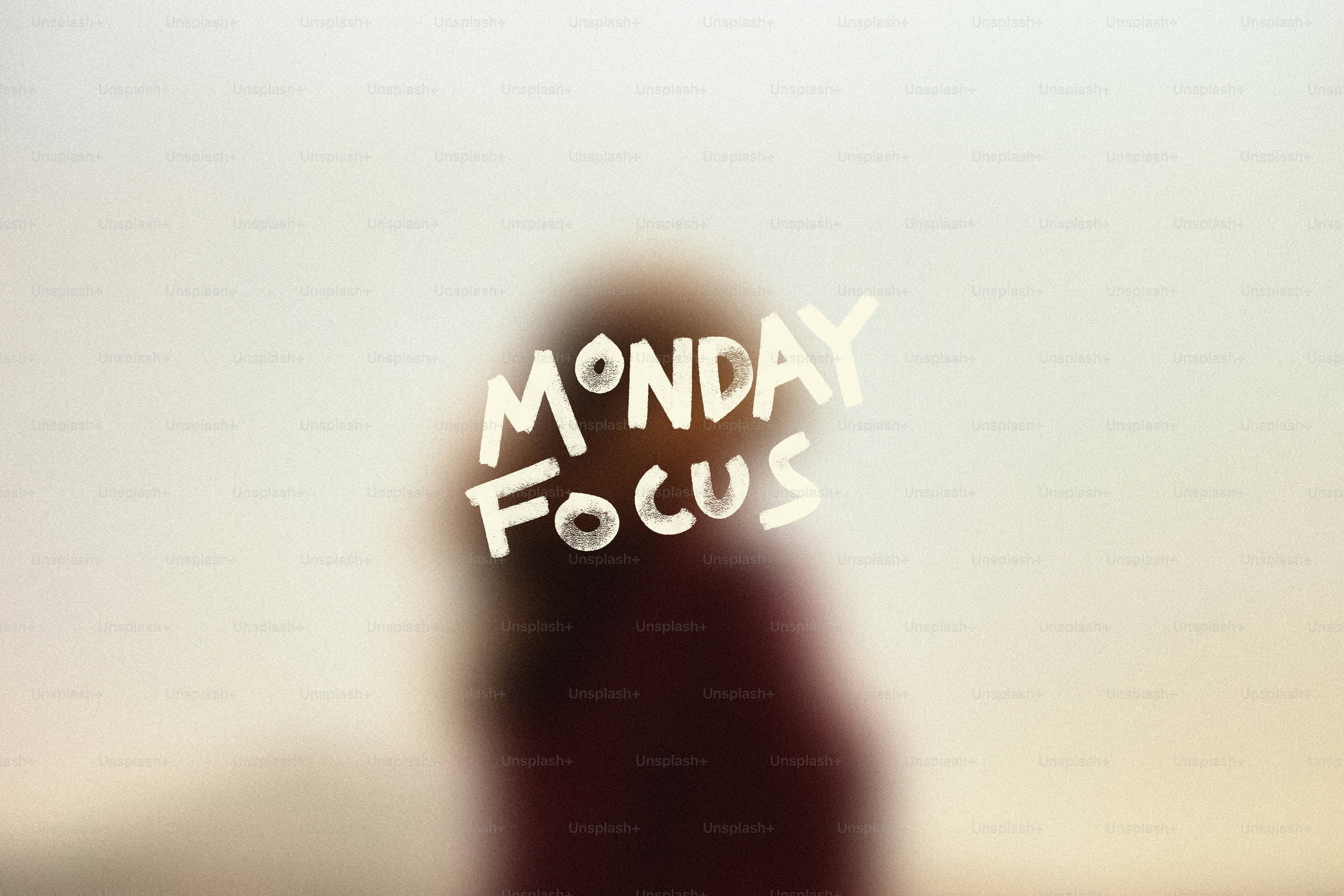 Blurred person with "monday focus" text overlay