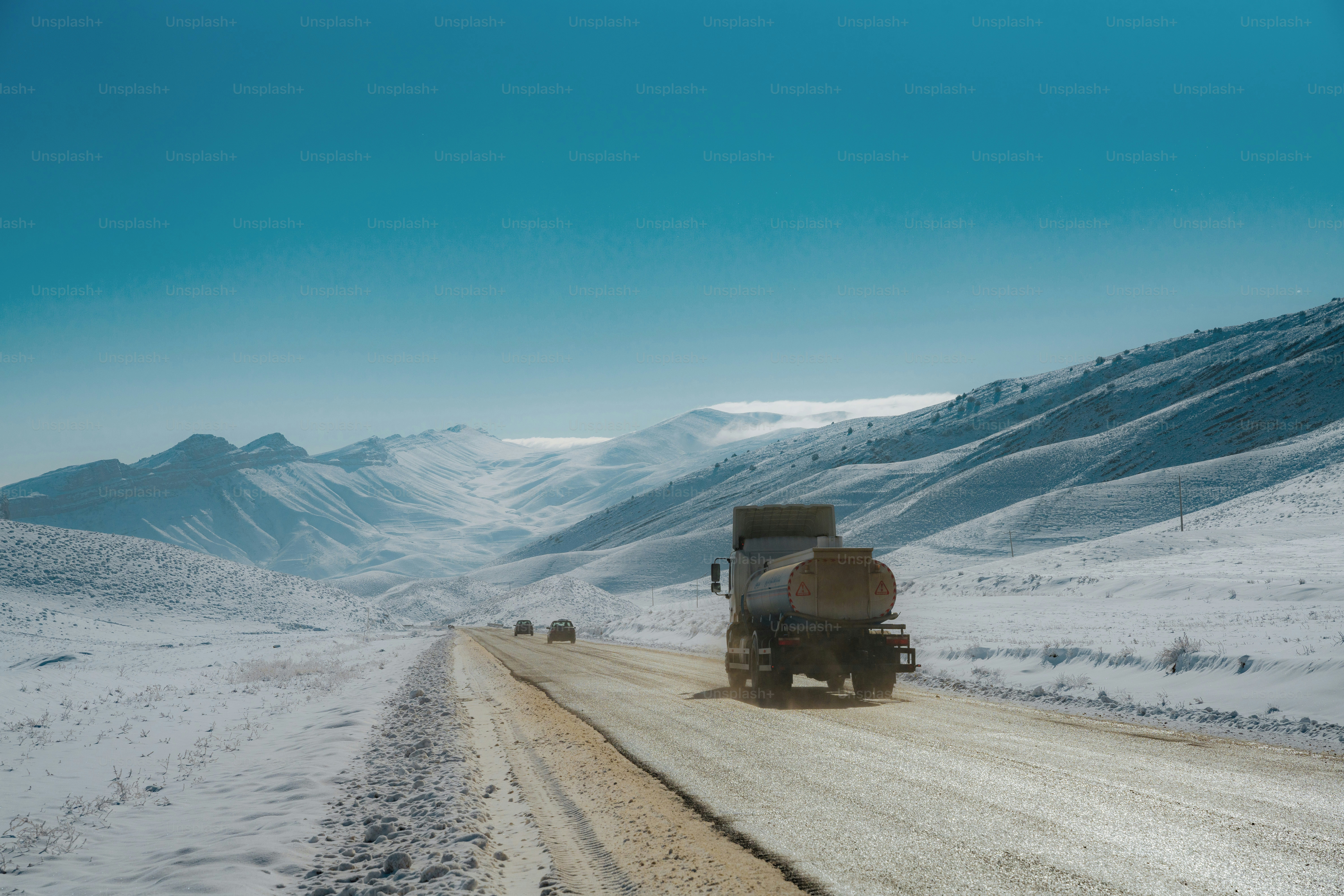 Truck driving on a snowy mountain road photo – Truck Image on Unsplash