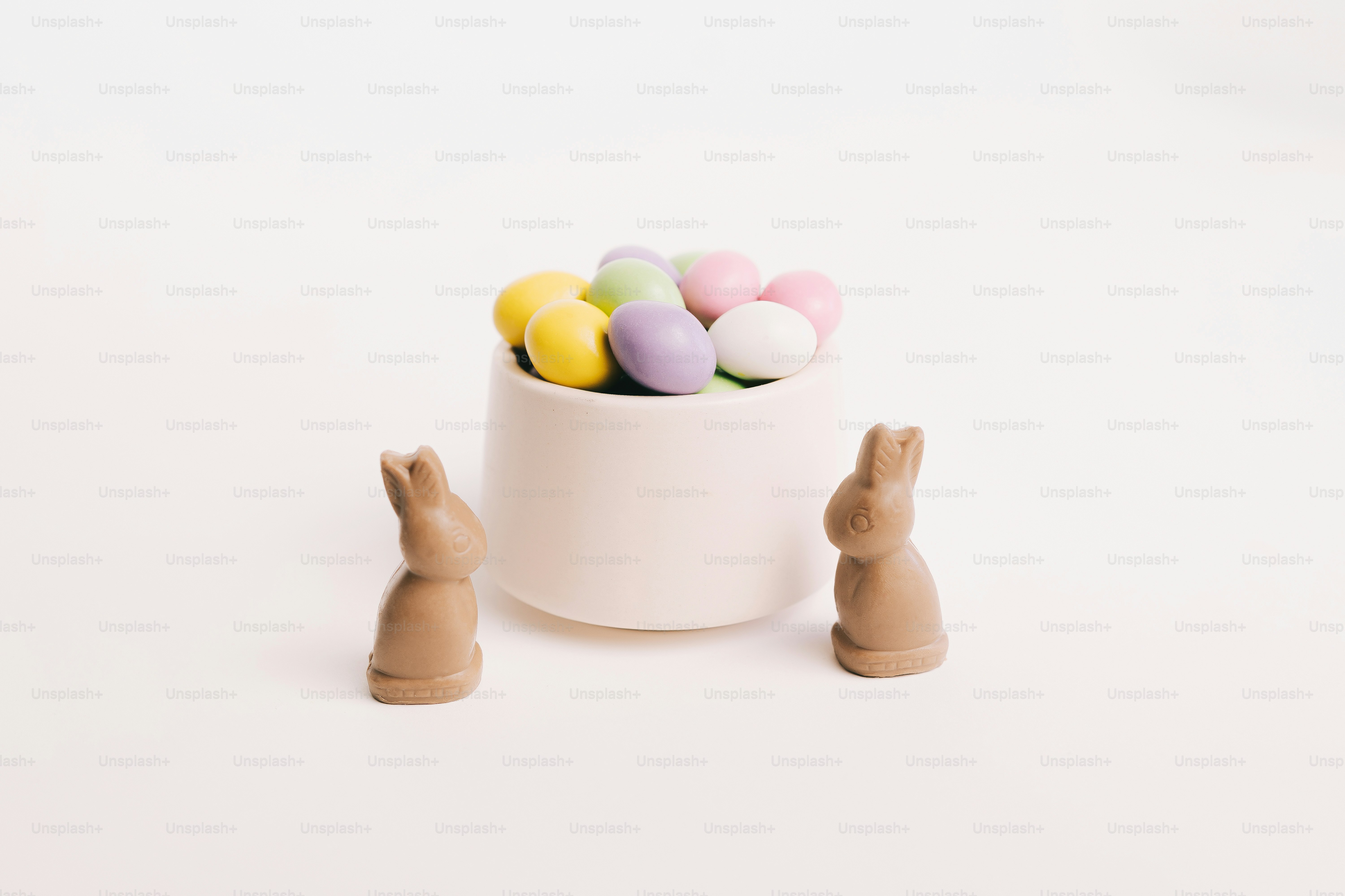Easter eggs and chocolate bunnies on a white background