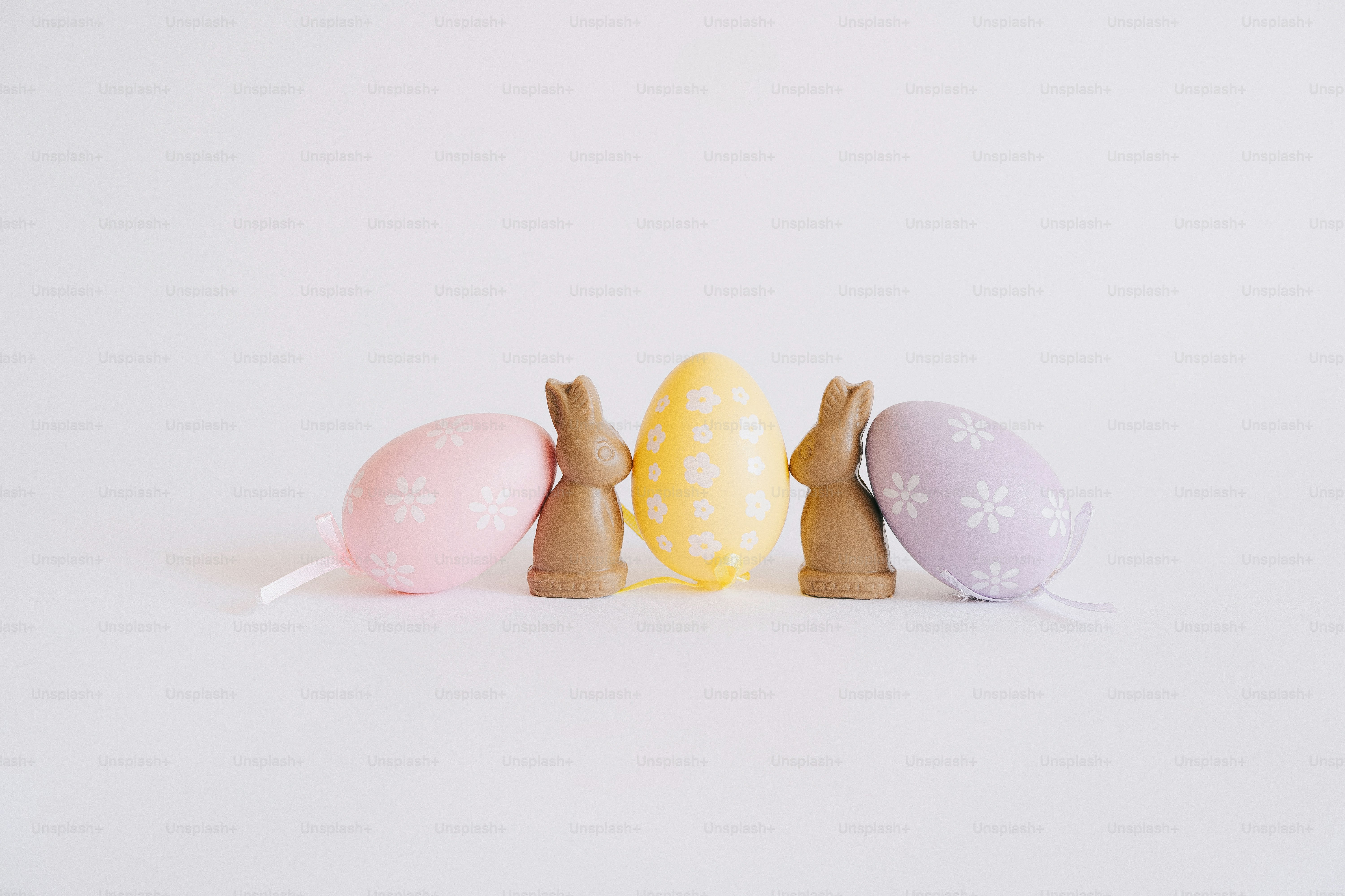 Easter eggs and chocolate bunnies on a white background