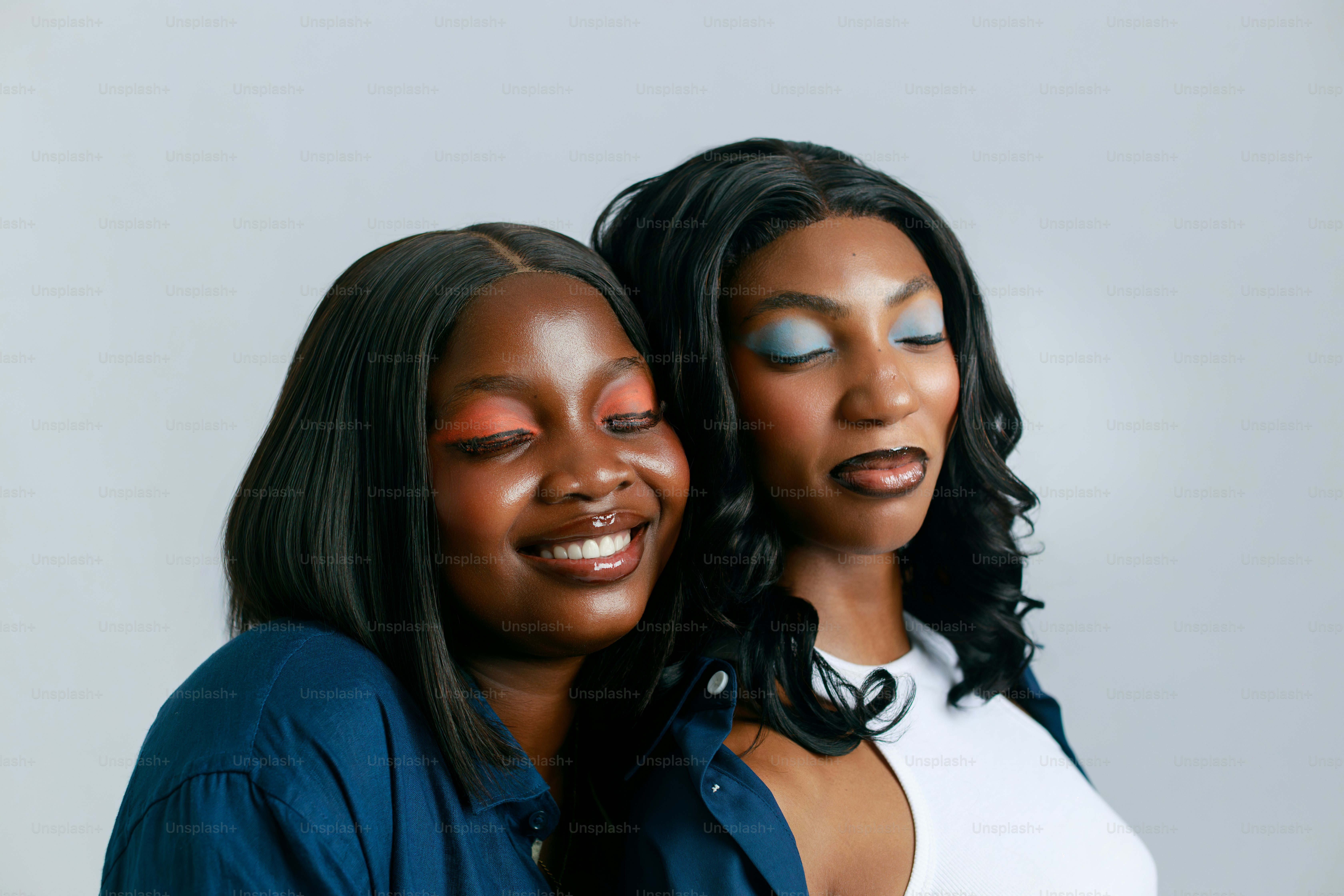 Two women with colorful eye makeup