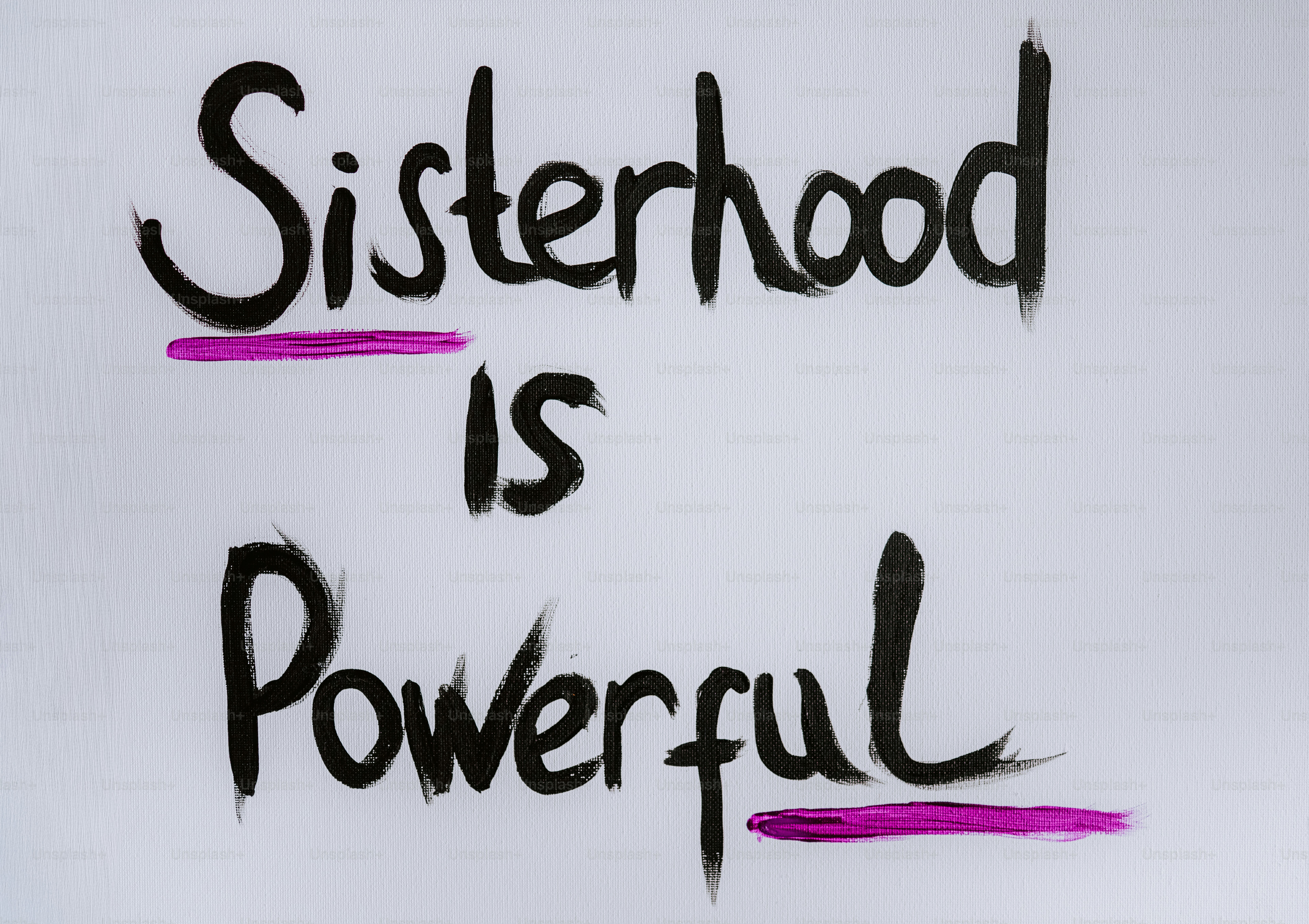 Sisterhood is powerful written on a white background