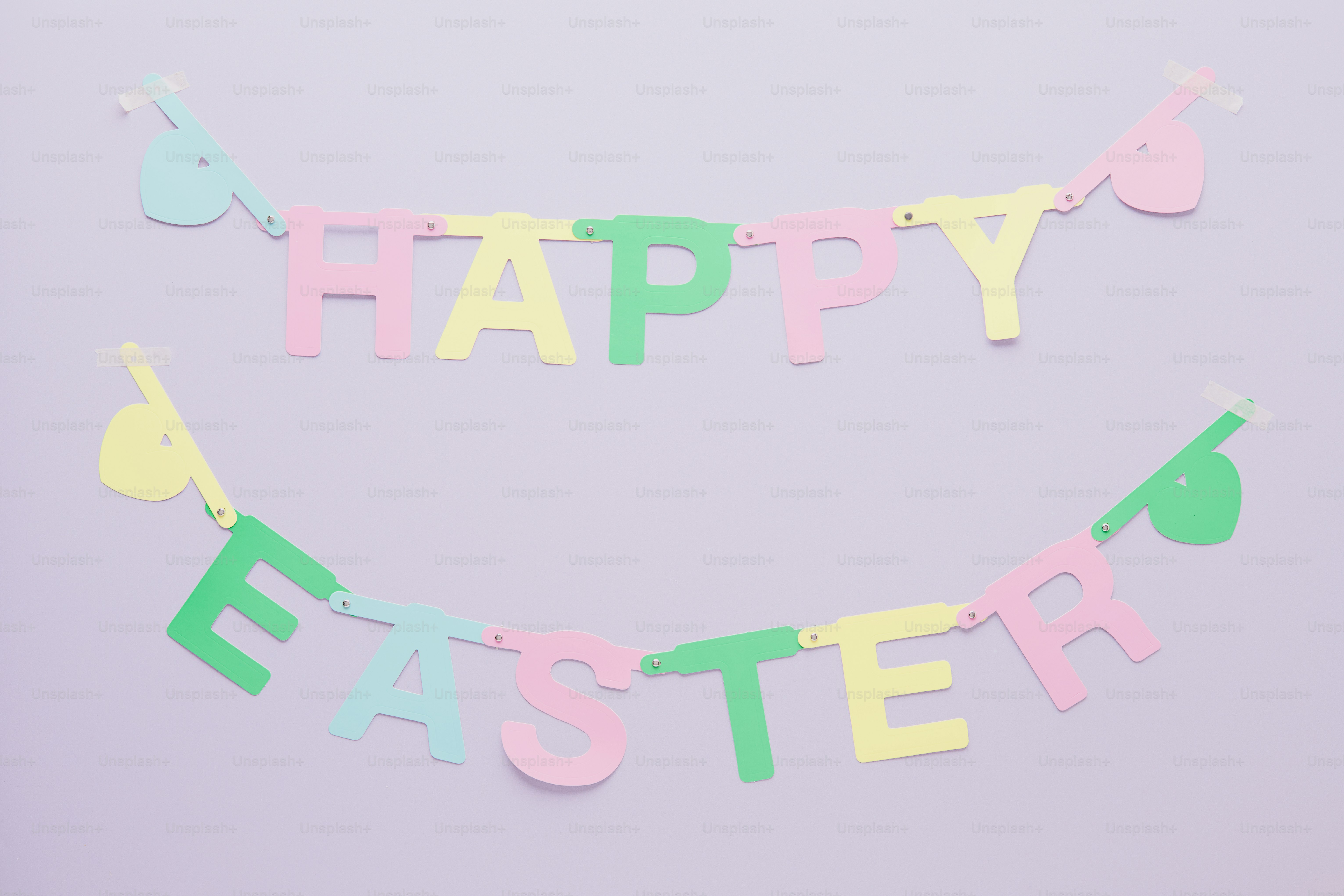 Pastel happy easter banner hanging on a wall
