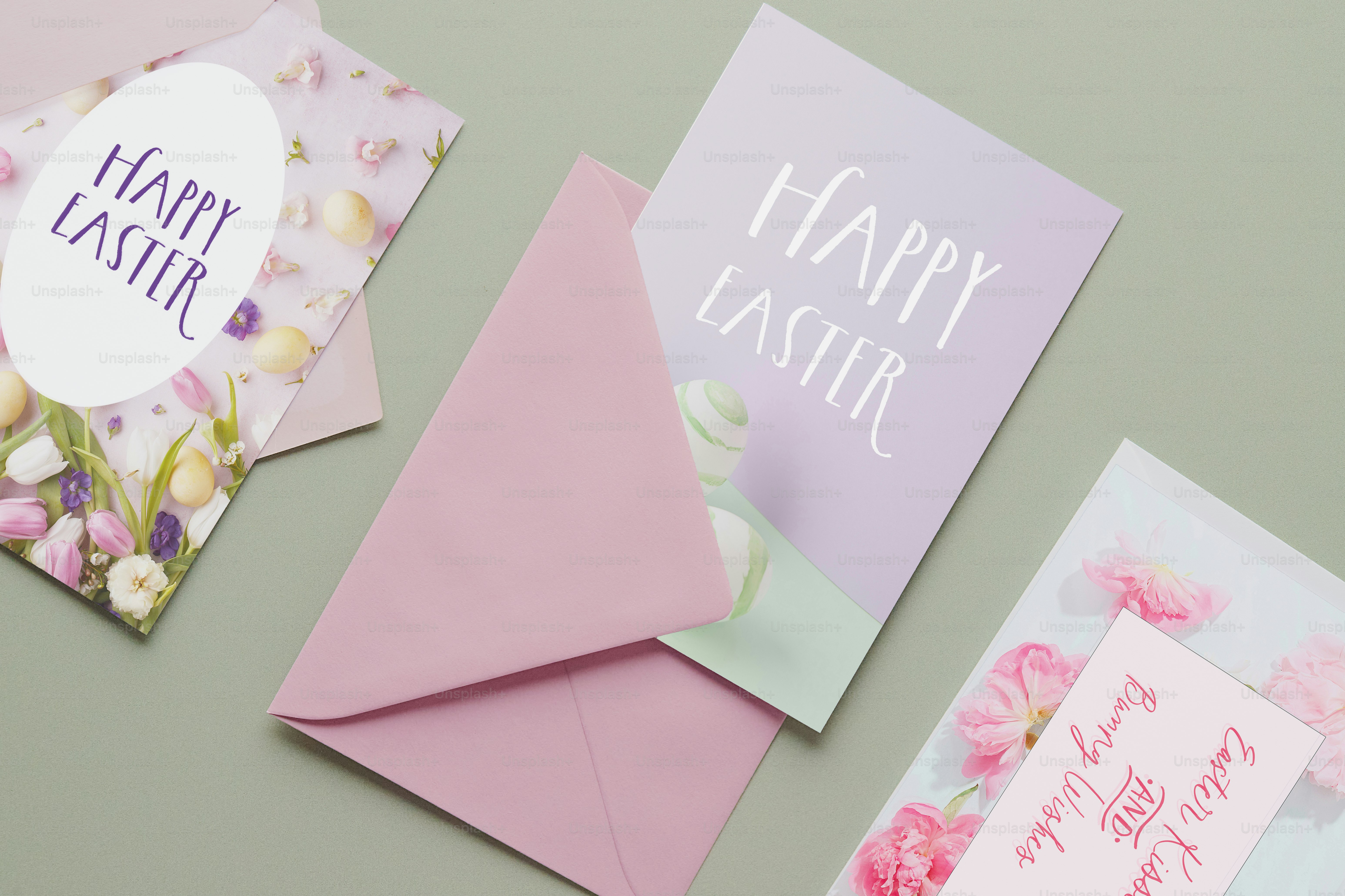 Several easter cards with envelopes on a green background.