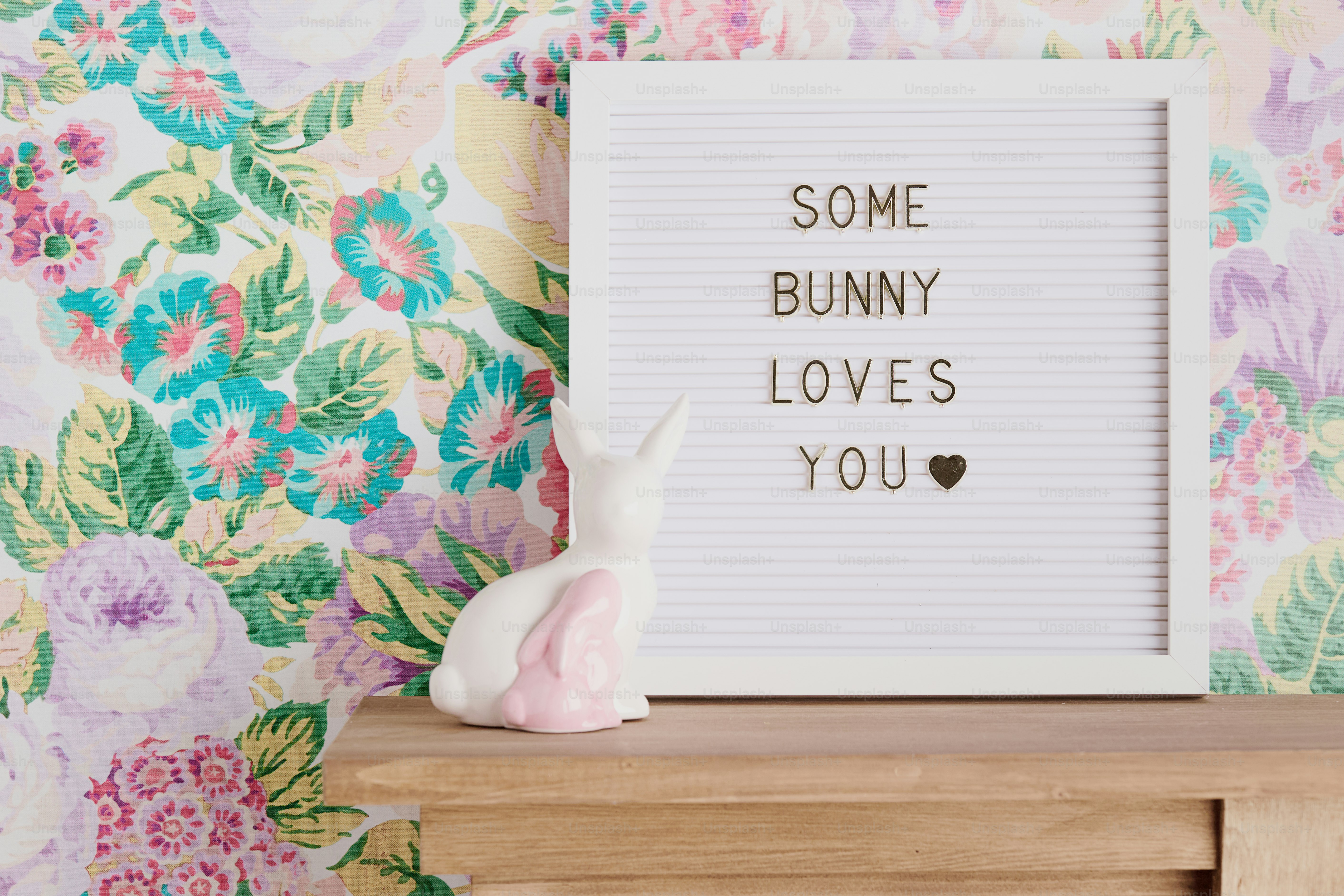 White letter board with "some bunny loves you" text.