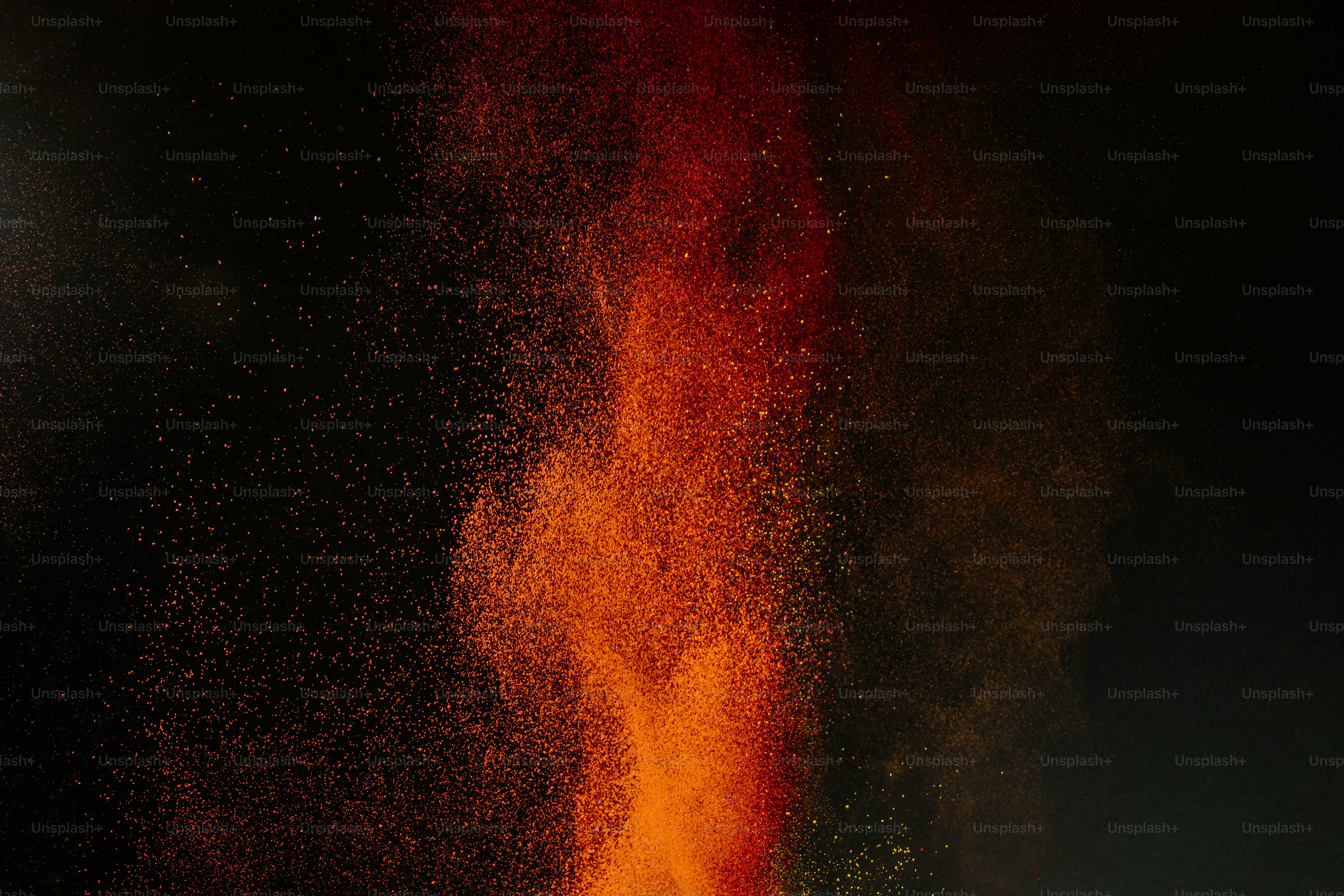 Colorful powder exploding against a black background photo – Background ...