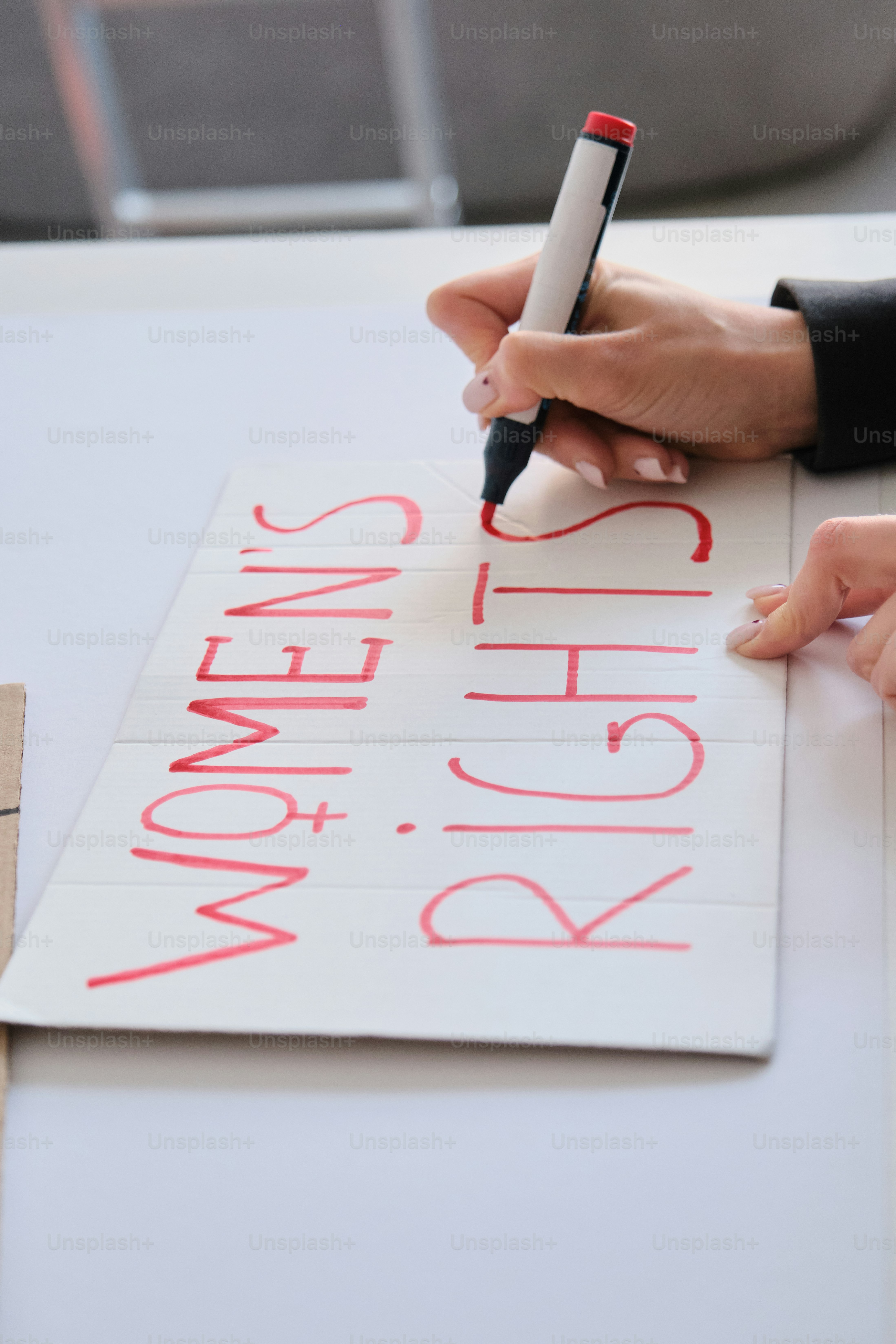Hand holding sign that says the future is female photo – Change Image ...