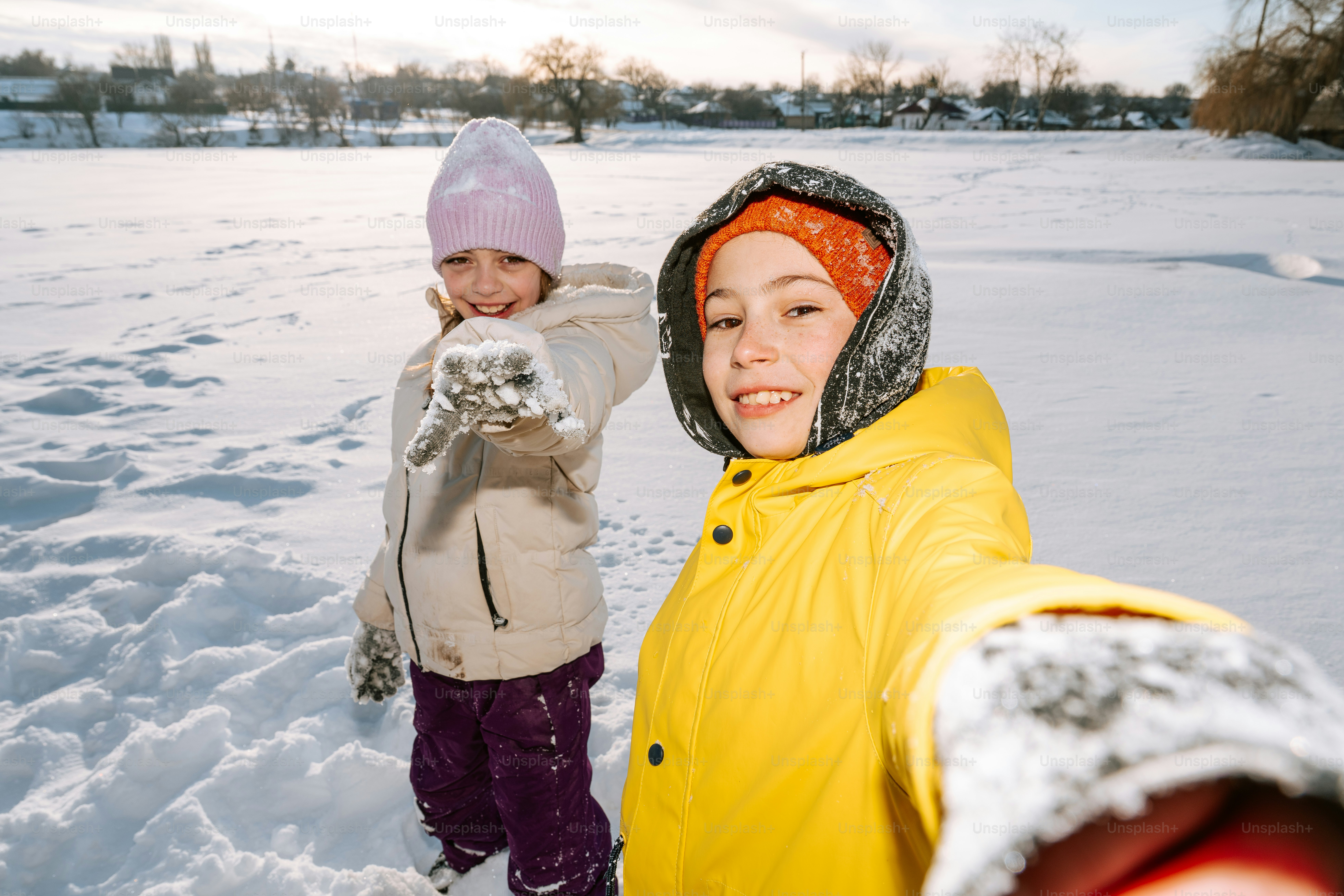 Two children playing in the snow photo – Kids Image on Unsplash