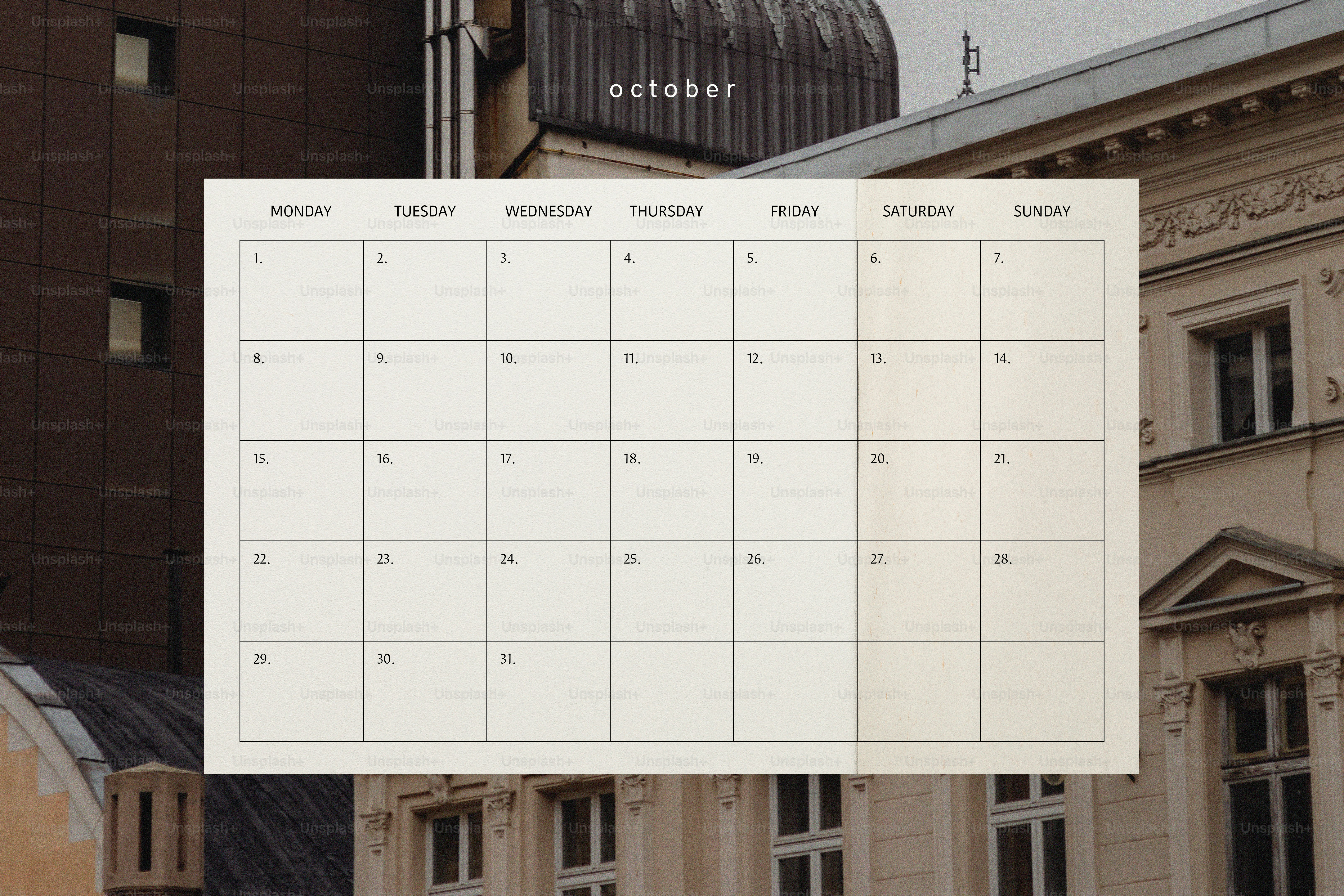 A blank calendar page for october with building background