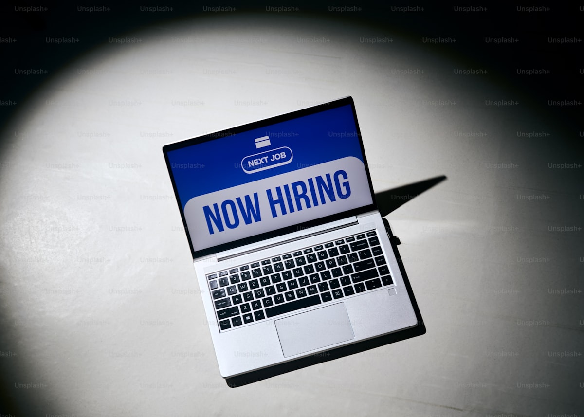 Staffing firm owner reviewing their website that needs to convert both employers and job seekers in the Dallas and Plano market