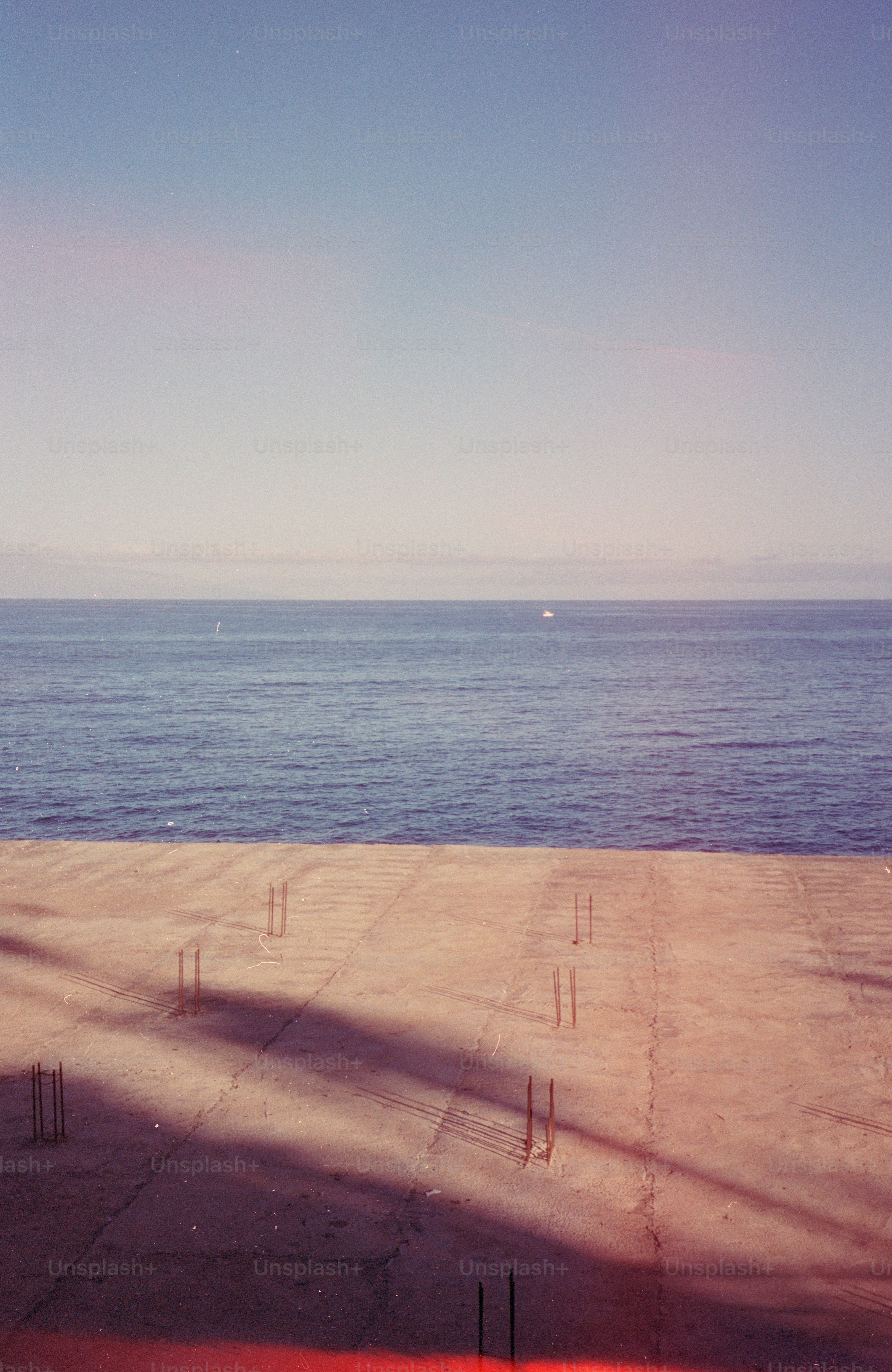 Concrete foundation with rebar near the ocean