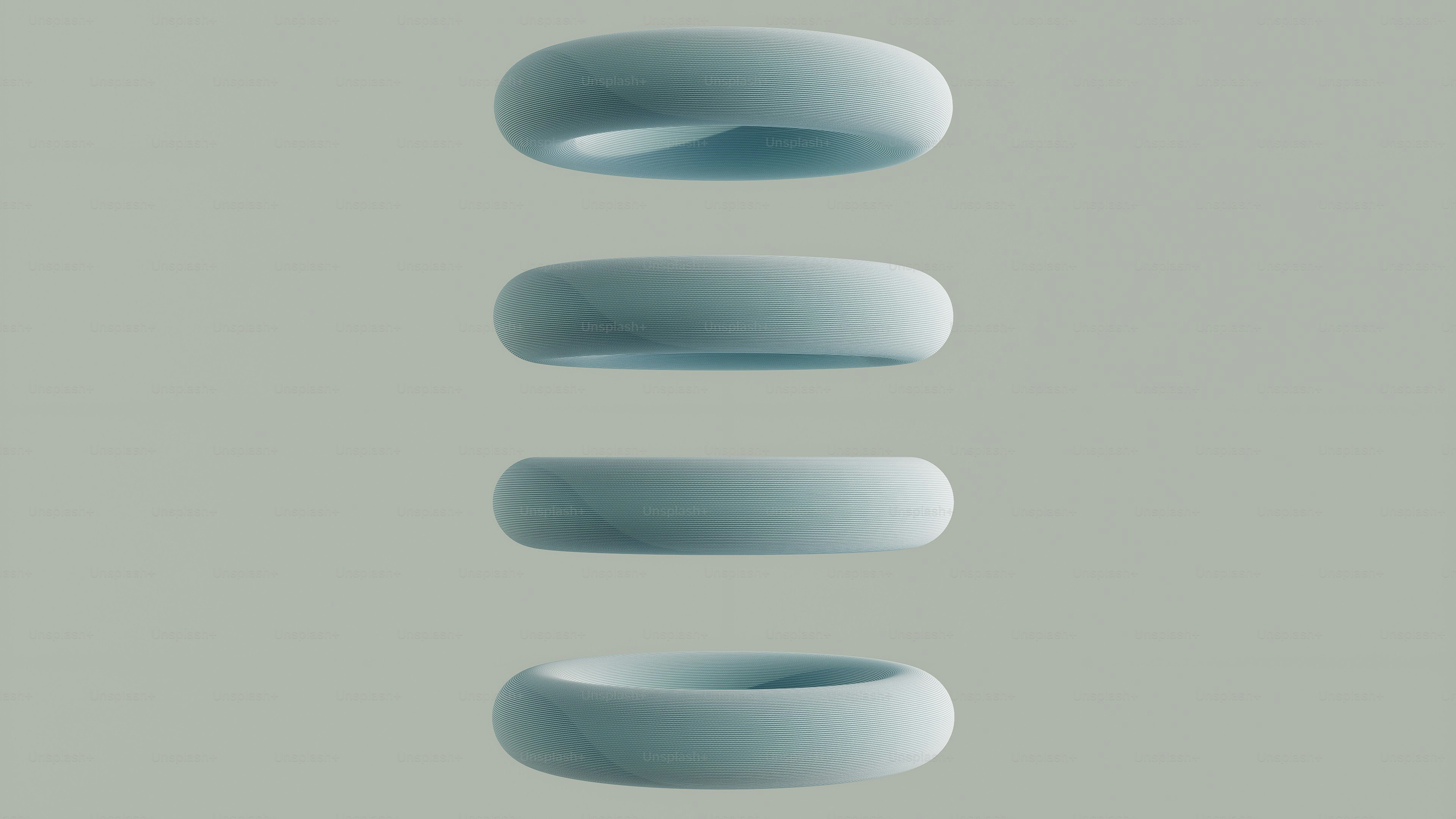 Four light blue torus shapes floating vertically