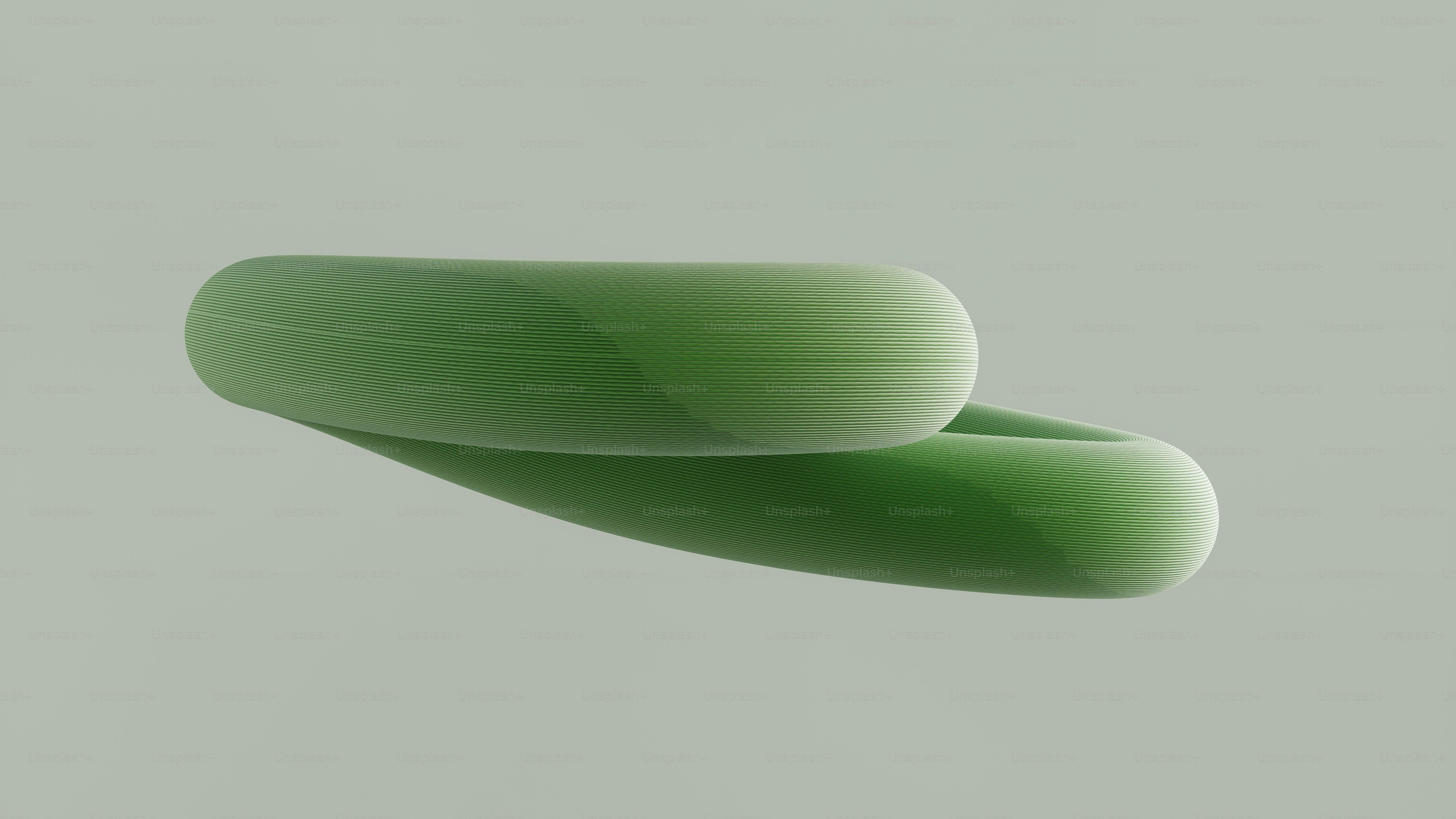 Two smooth green abstract shapes overlap