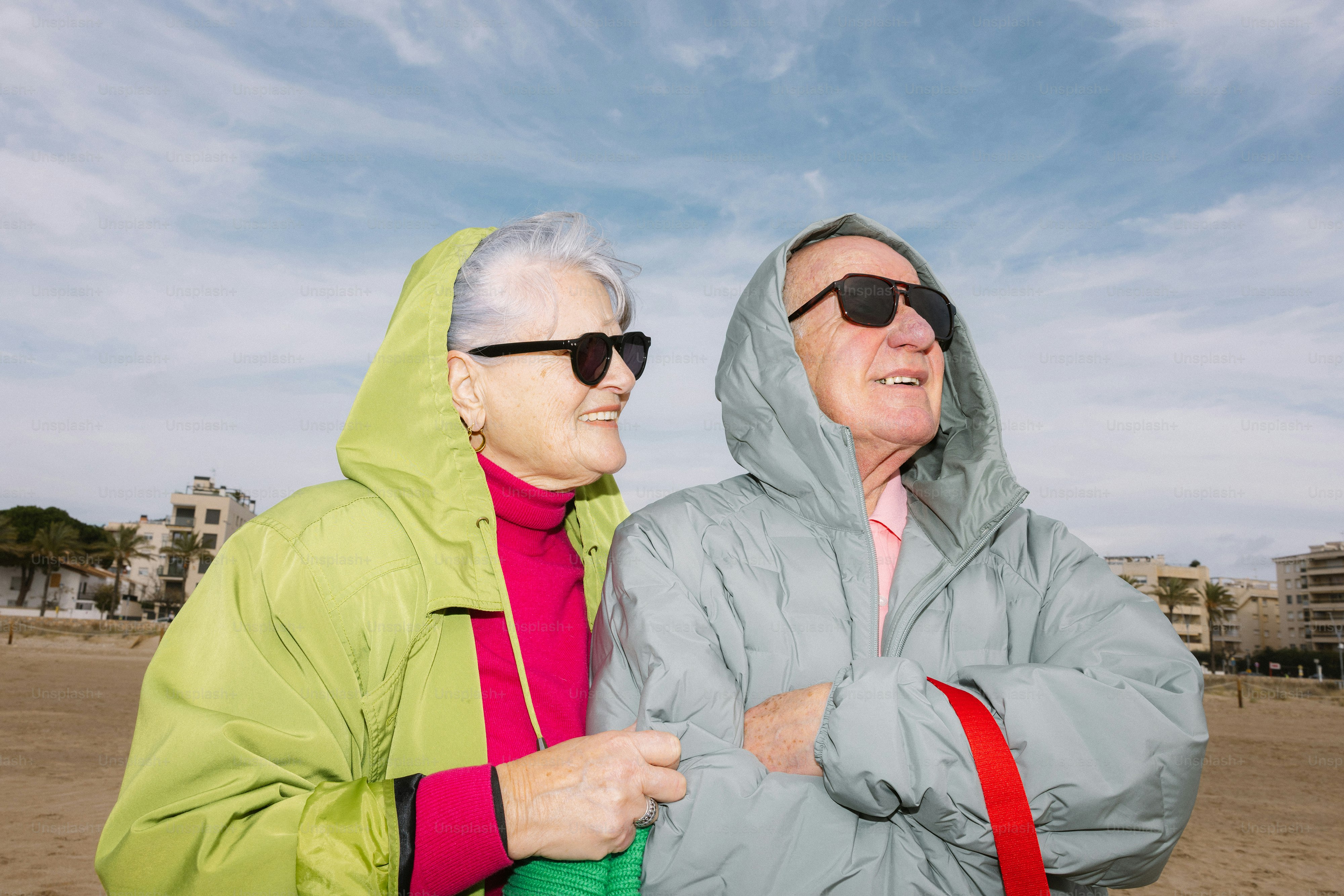 Elderly couple looking at a map by the water photo – Travel Image on ...