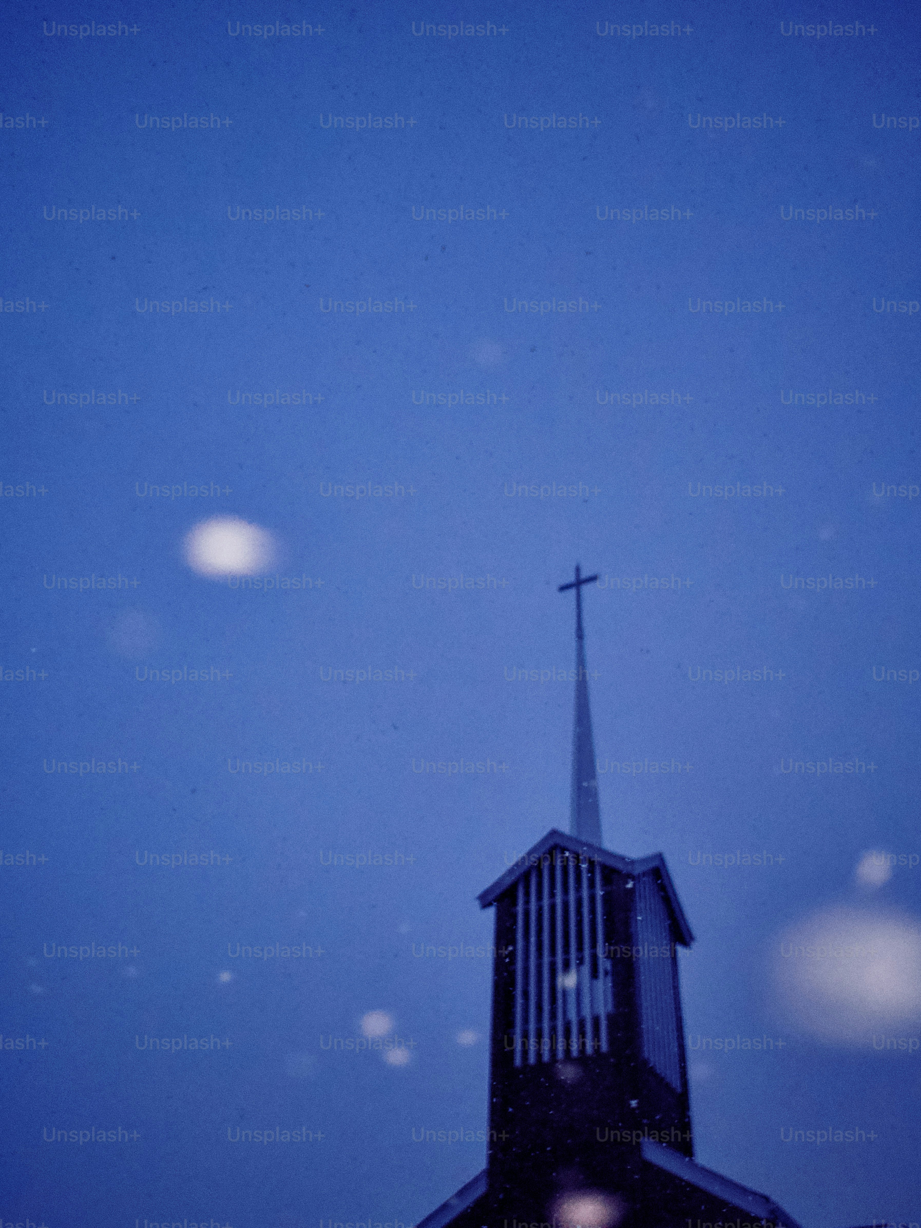 Church steeple against a dark blue sky