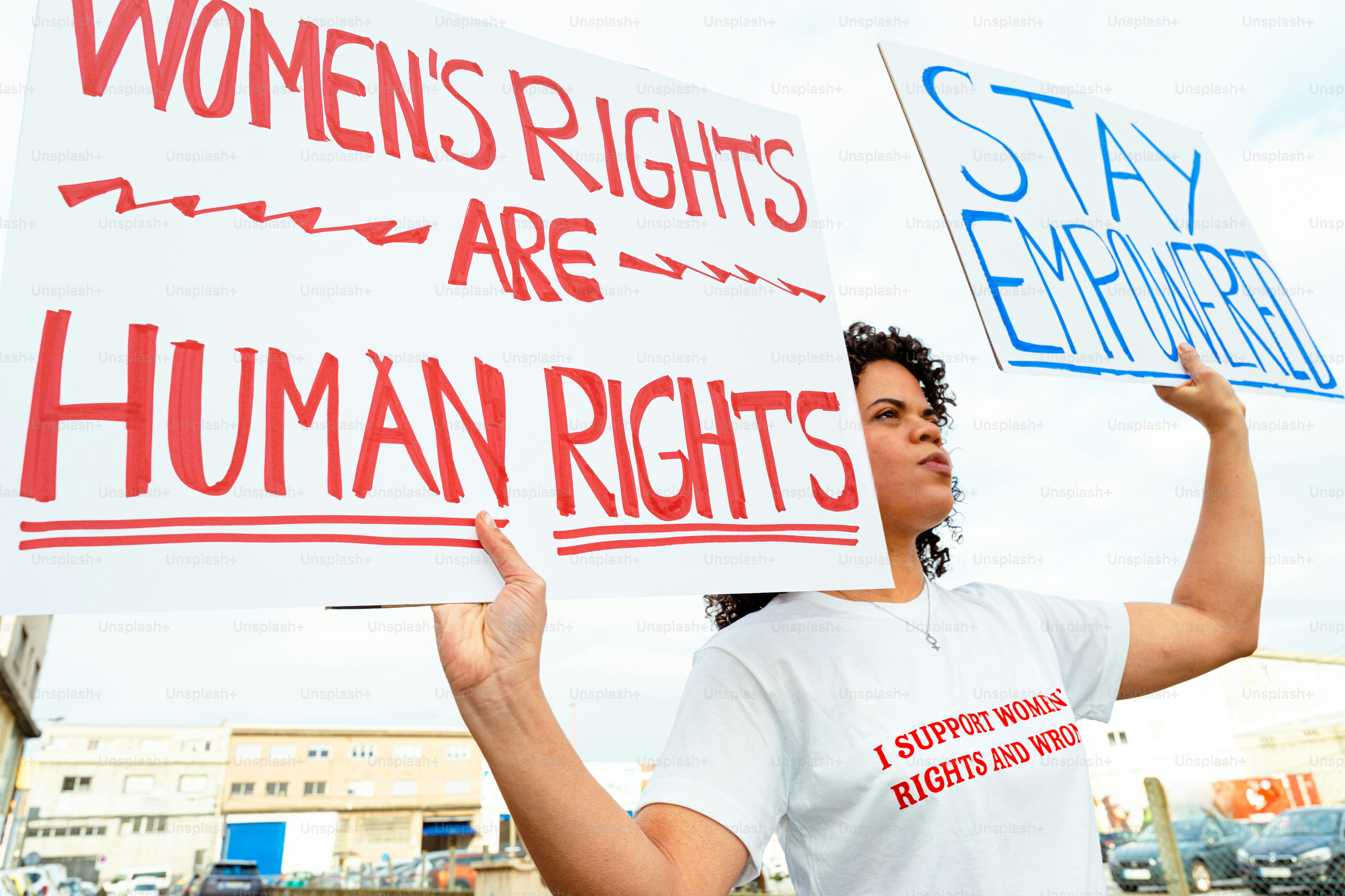 Woman holding signs for women's rights