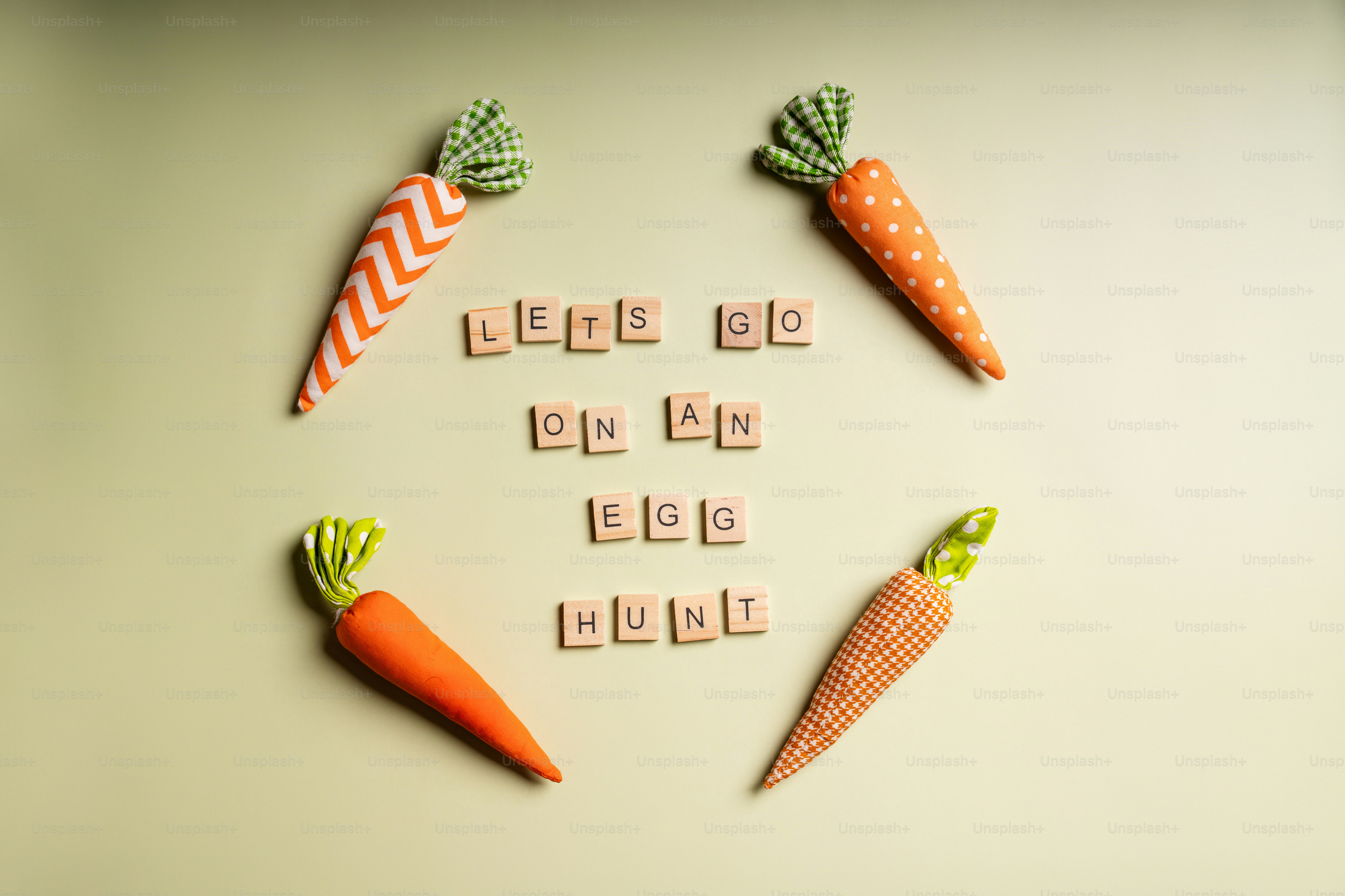 Carrots and tiles spell "let's go on an egg hunt"