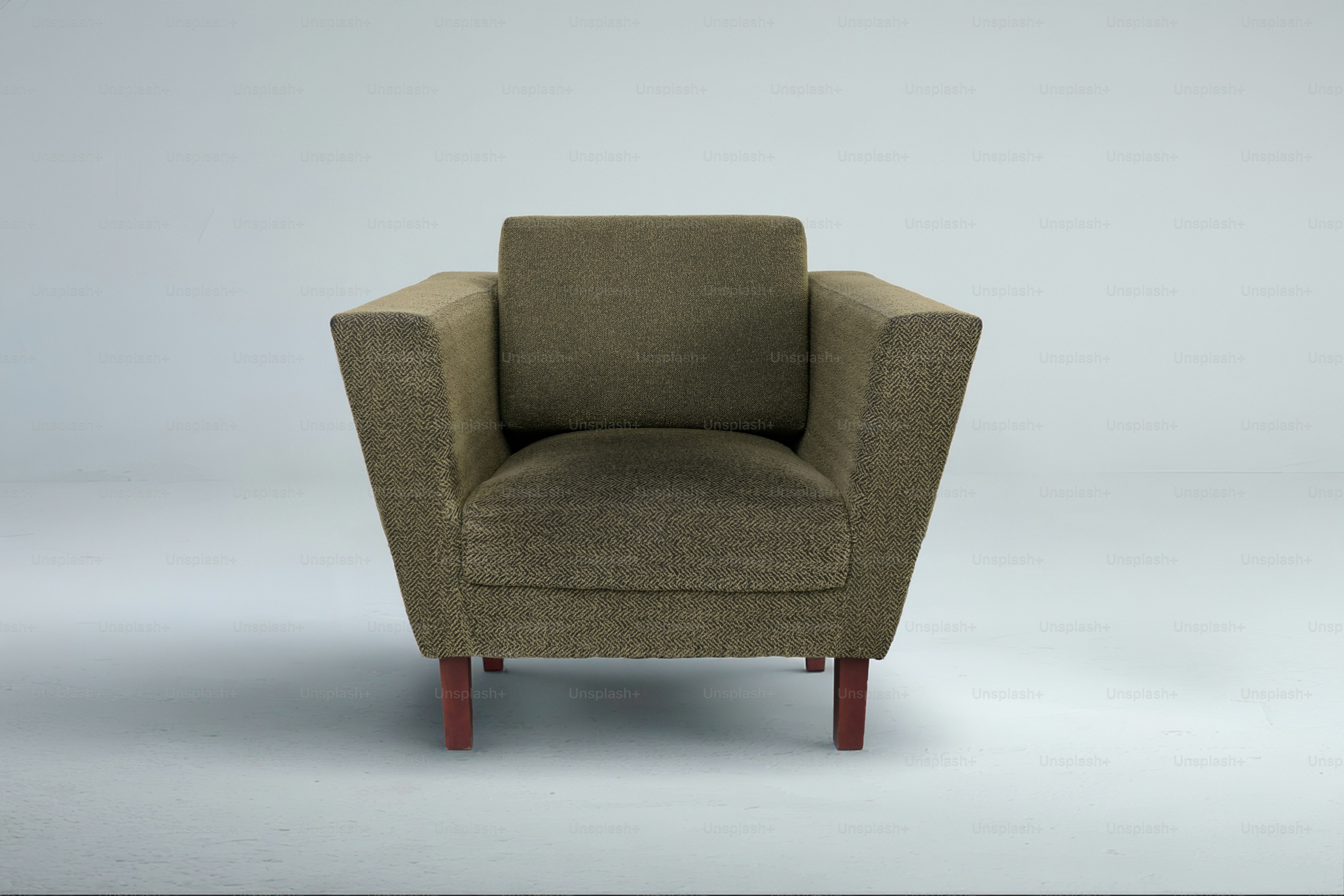 A single modern armchair with four legs
