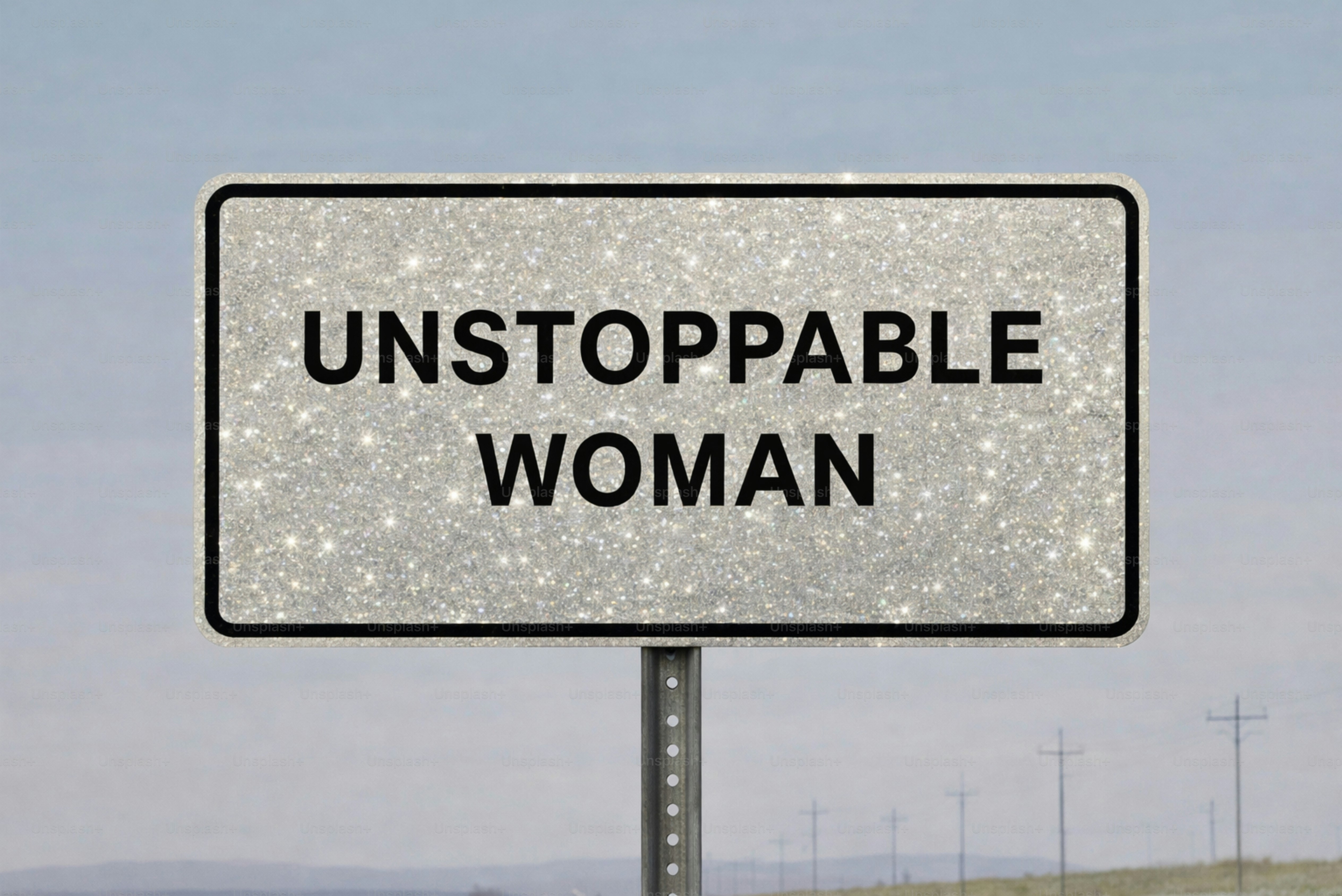 A sparkly sign reads "unstoppable woman"