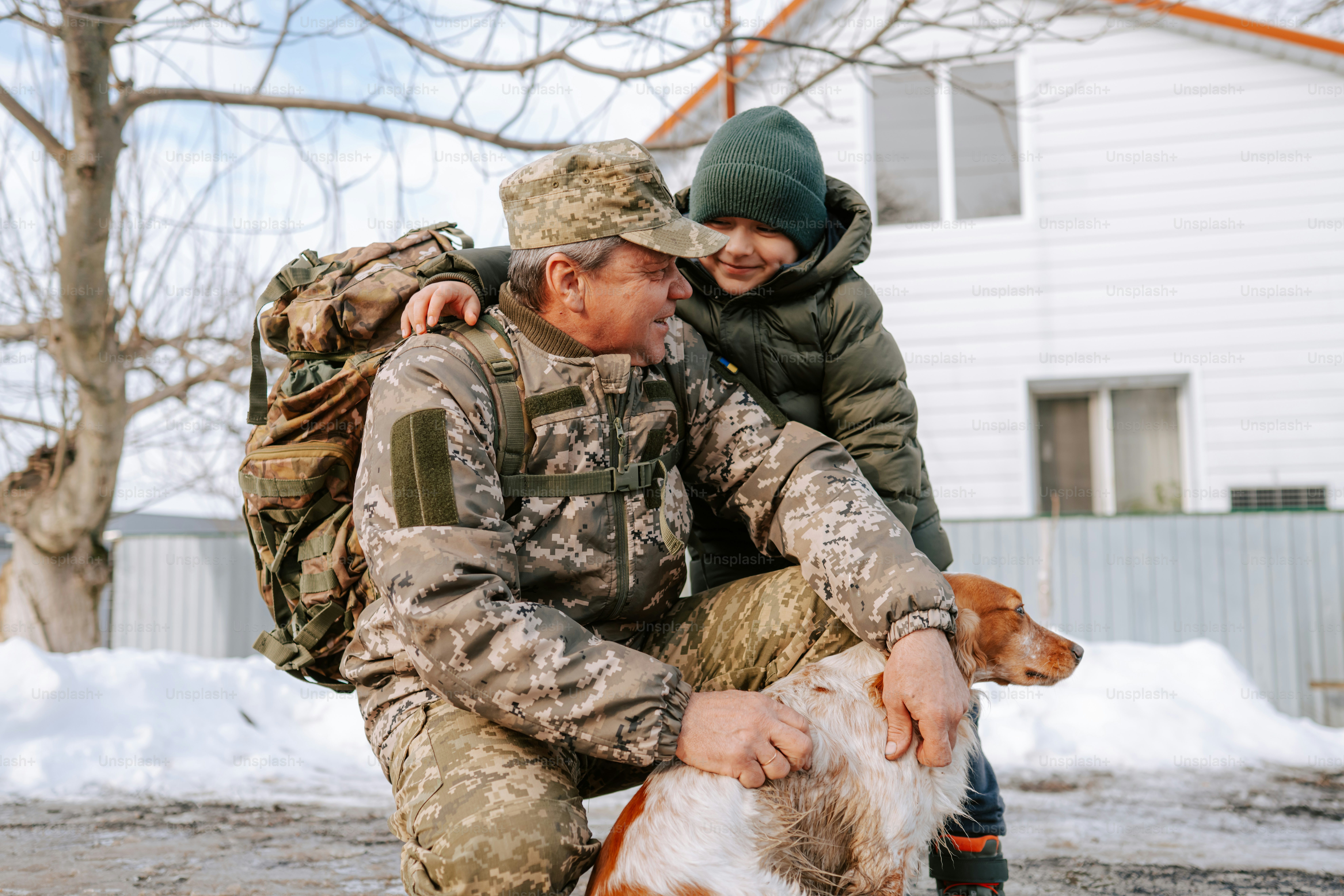 Soldier with son and dog outside house photo – Portrait Image on Unsplash