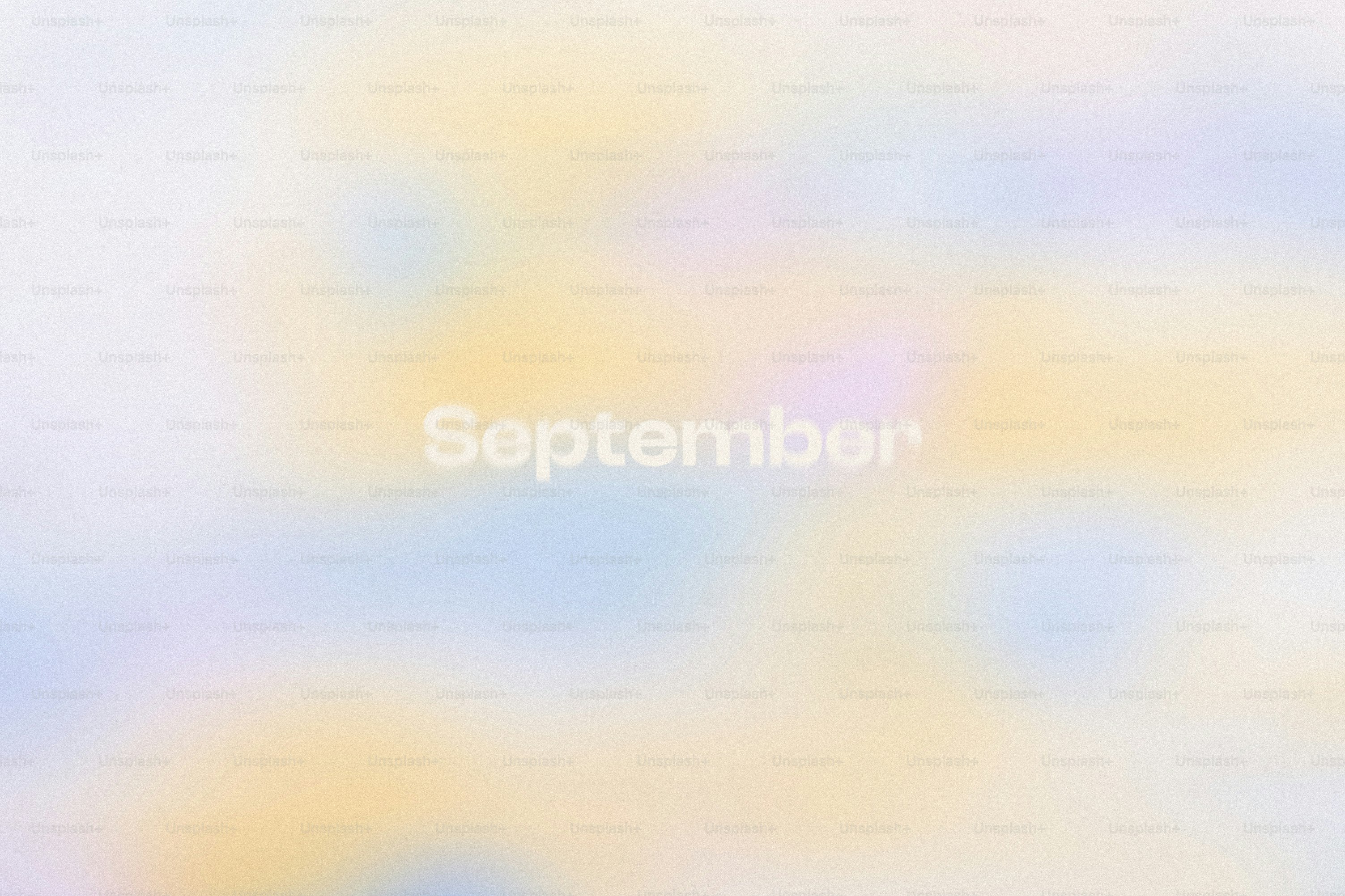 Soft pastel background with the word september