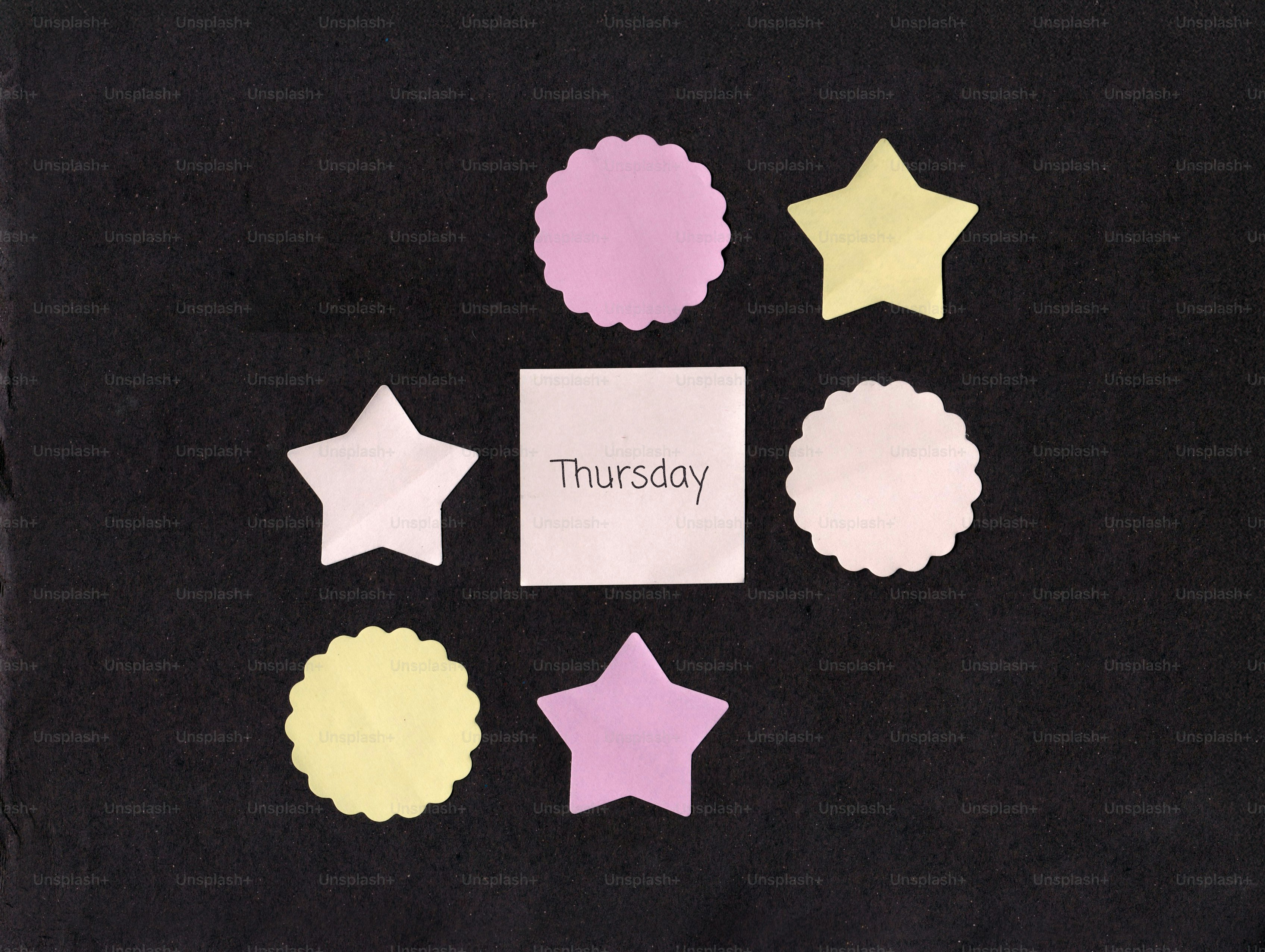 Square note with "thursday" surrounded by stars and circles