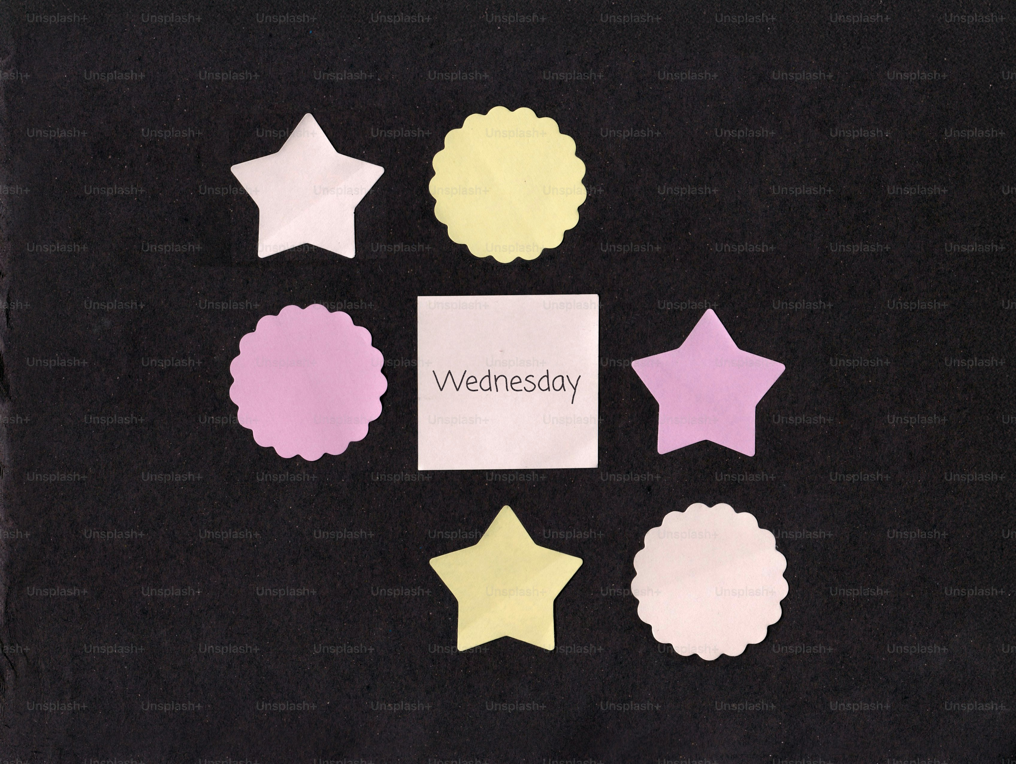 Stars and circles with wednesday note on black