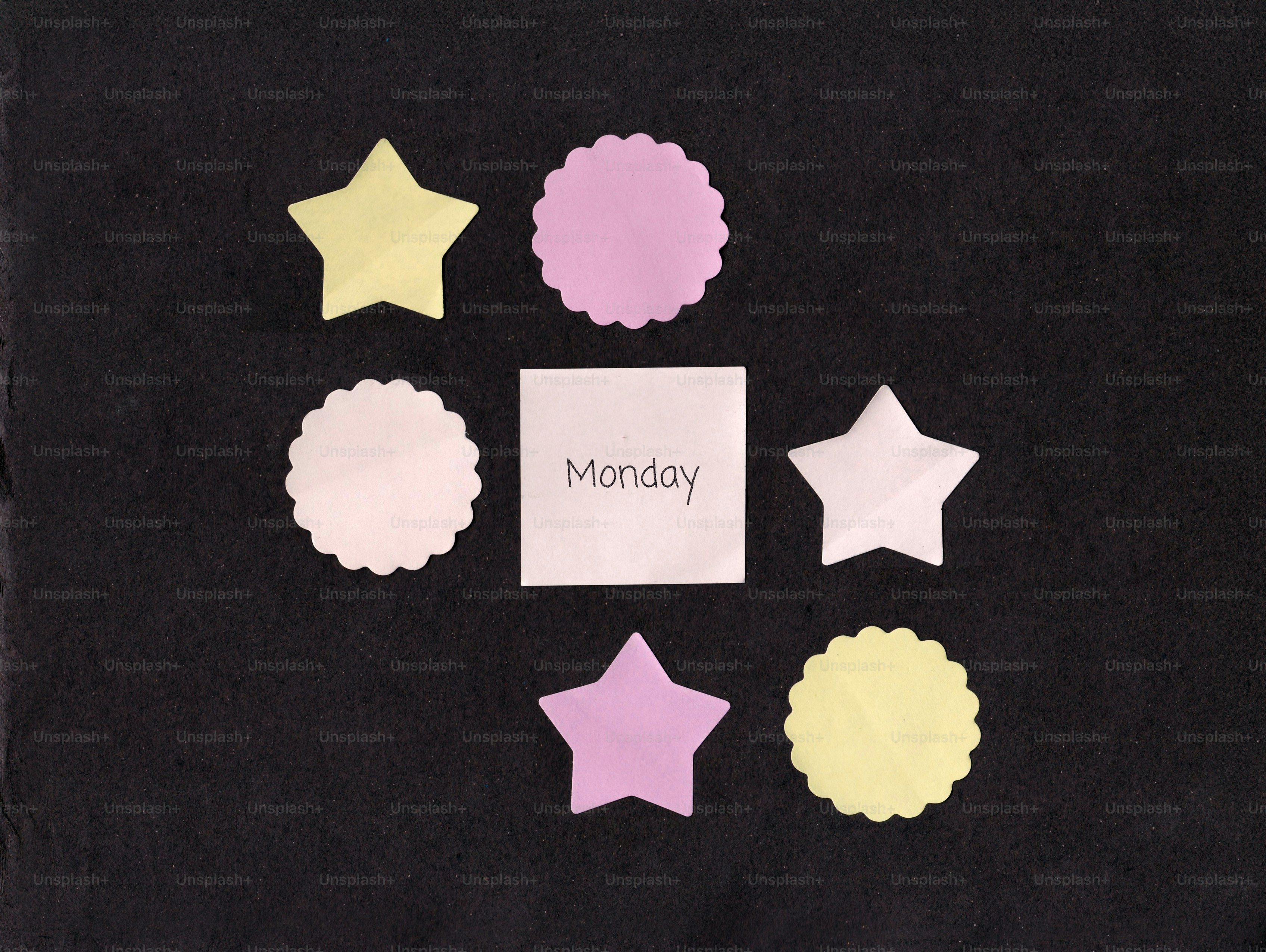 Shapes and a sticky note with monday on monday