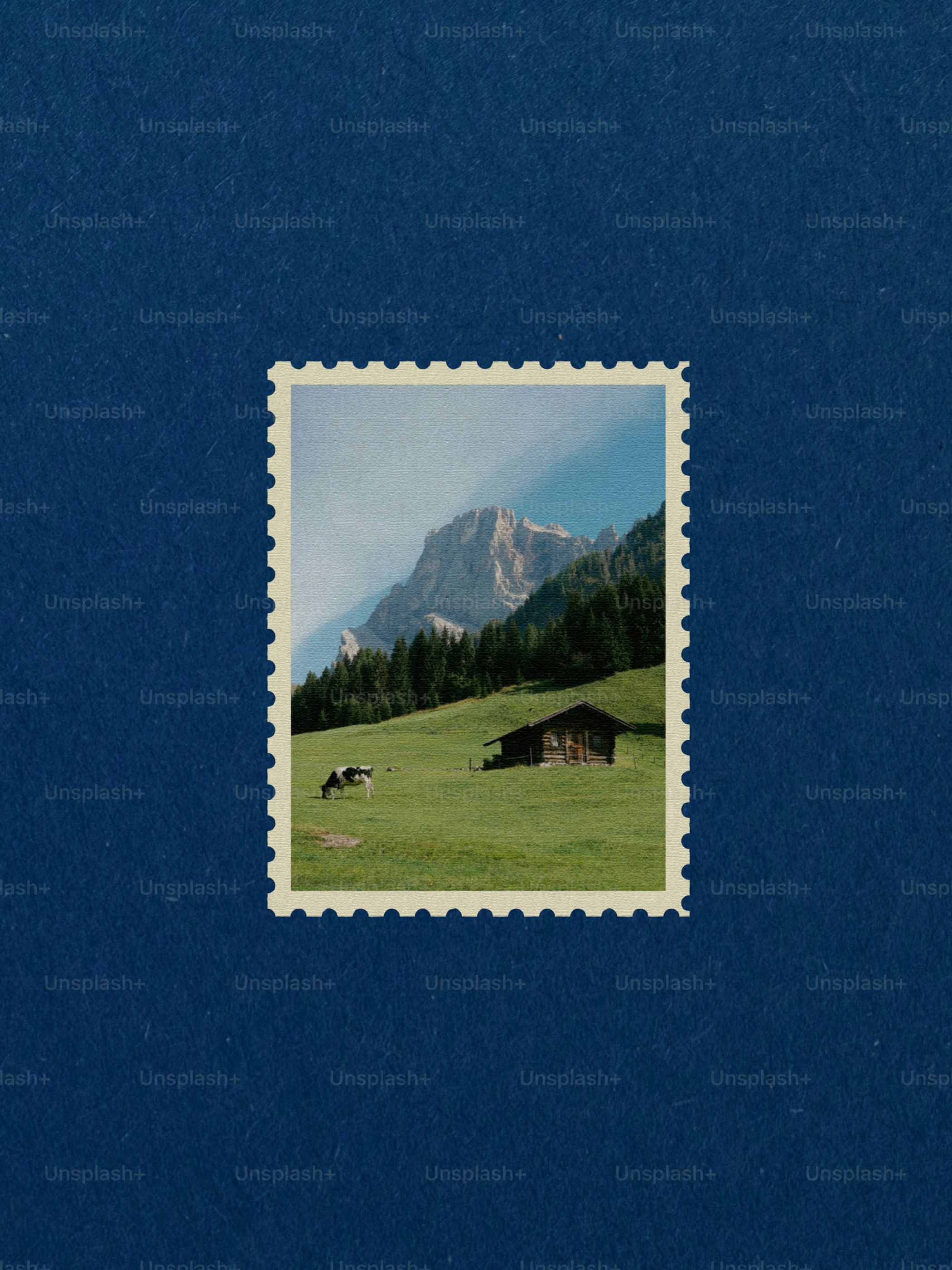 Paisaje montañoso con vacas y una cabaña