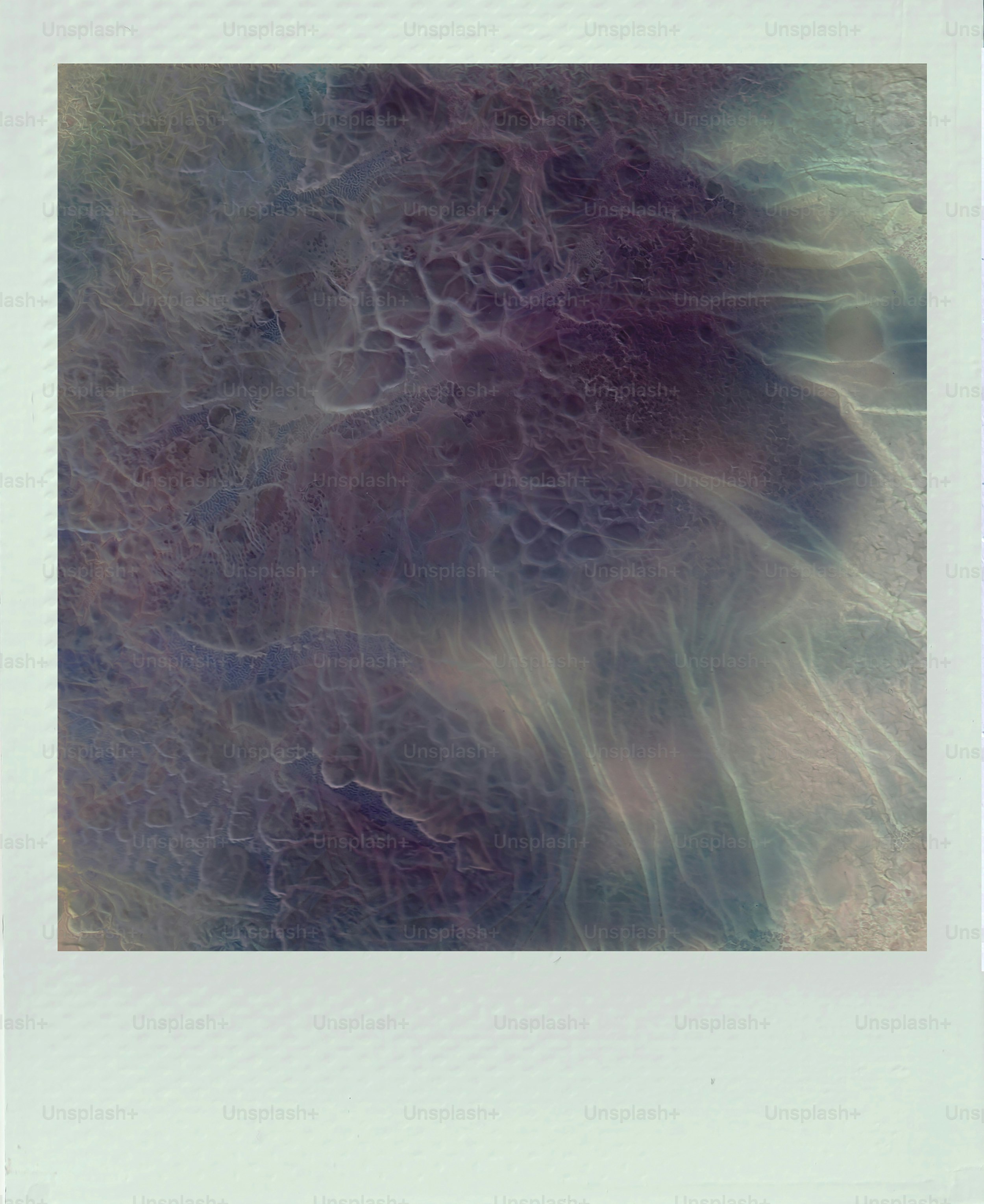 Abstract swirling patterns of purple and white