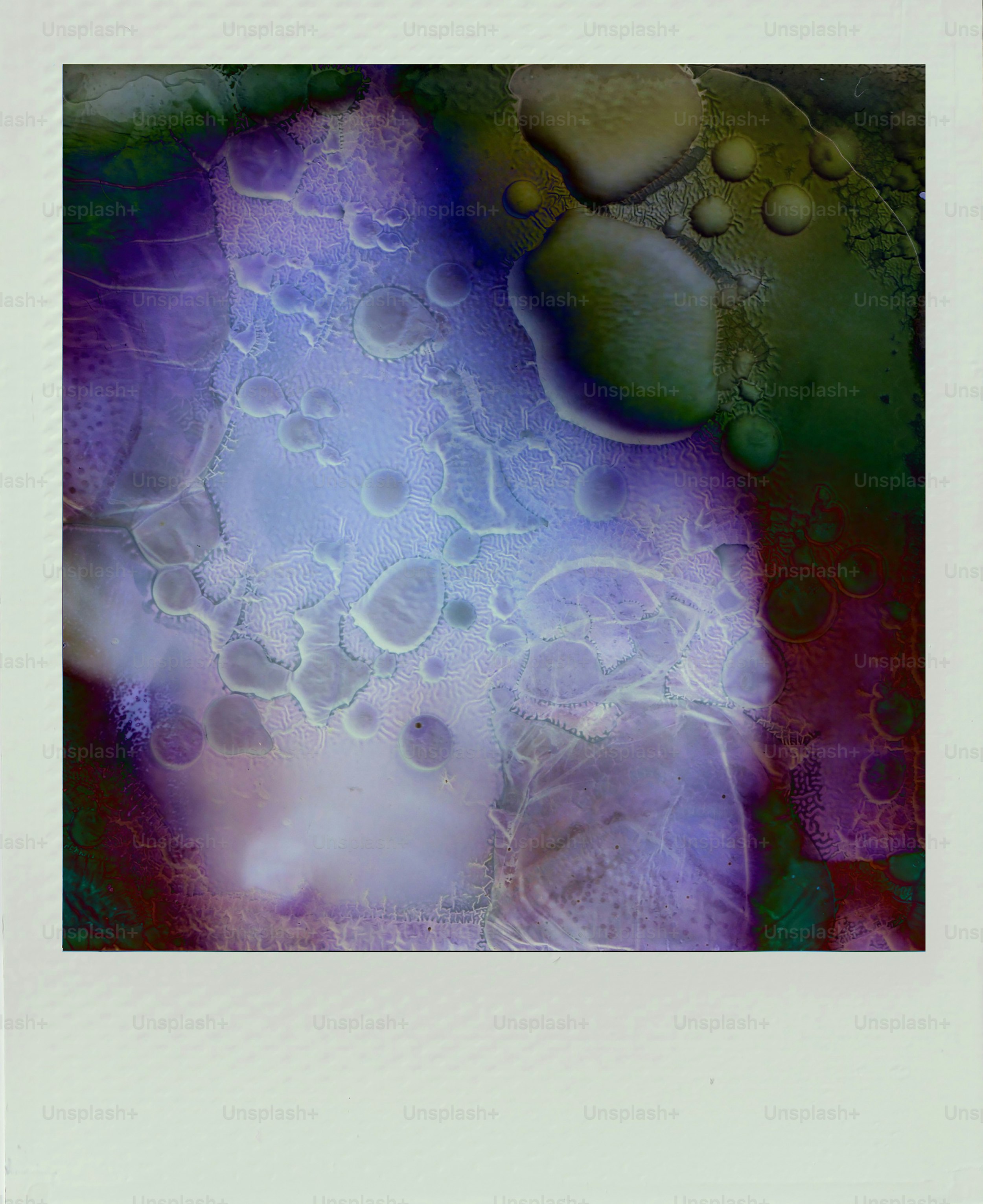Abstract colorful swirls and bubbles with dark edges.