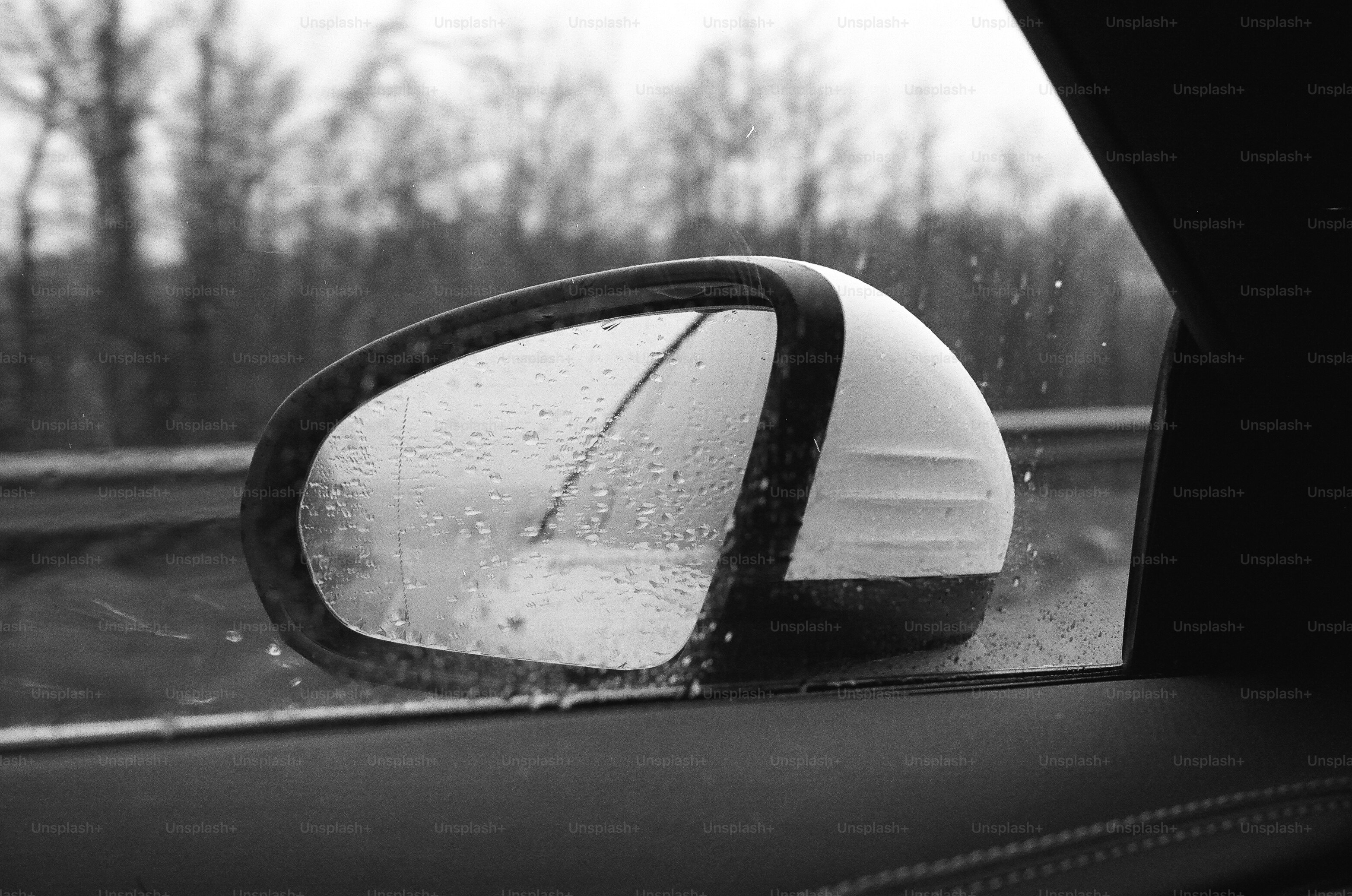 Side view mirror on a rainy day