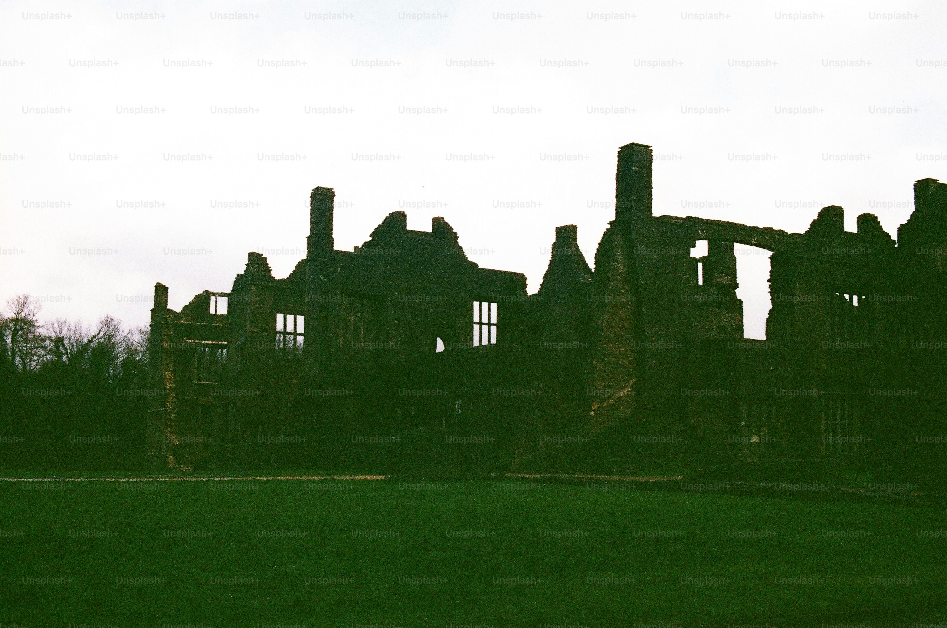 Ruined building with chimneys against a cloudy sky photo – Architecture ...