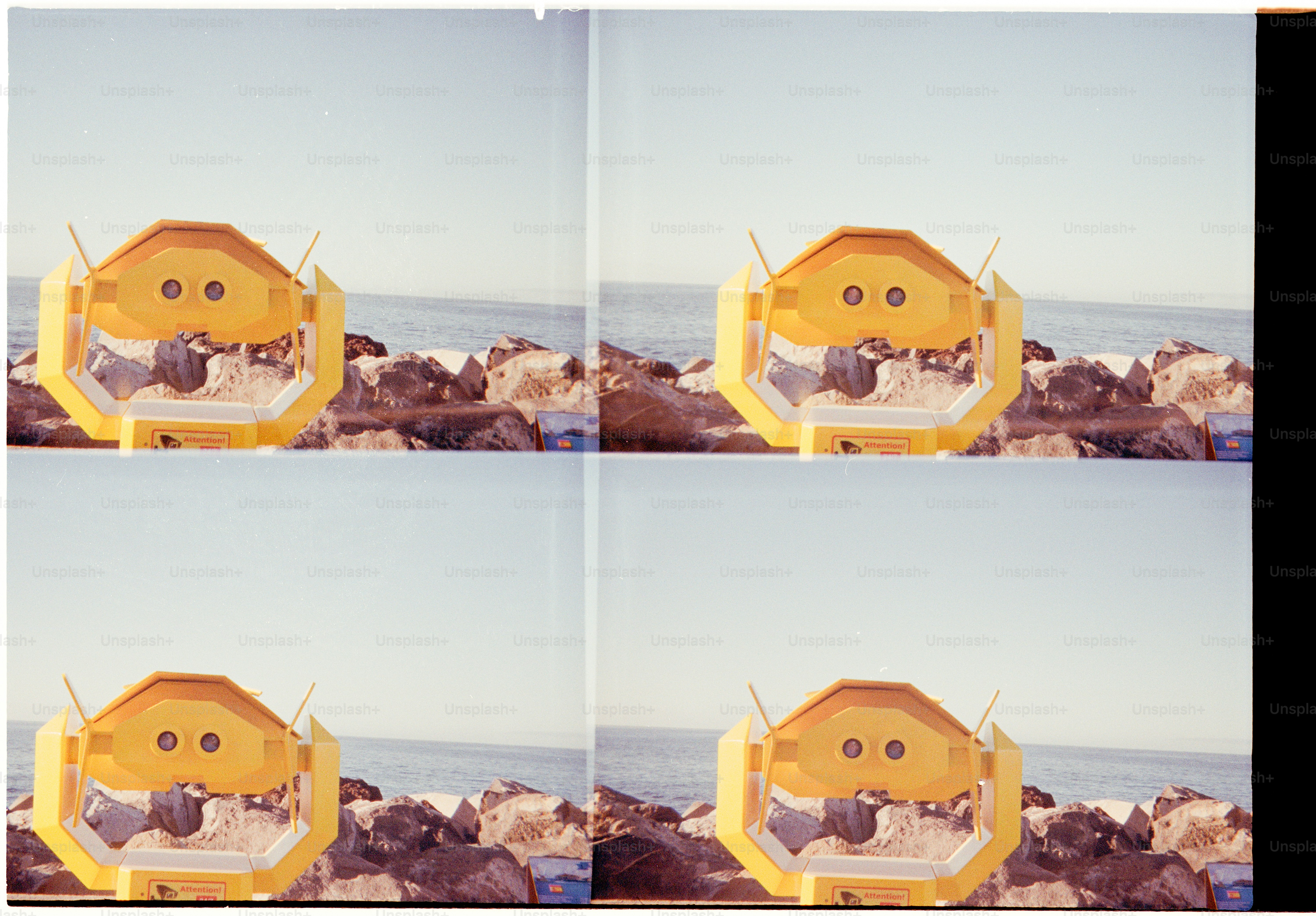 Four views of a yellow telescope on a rocky shore.