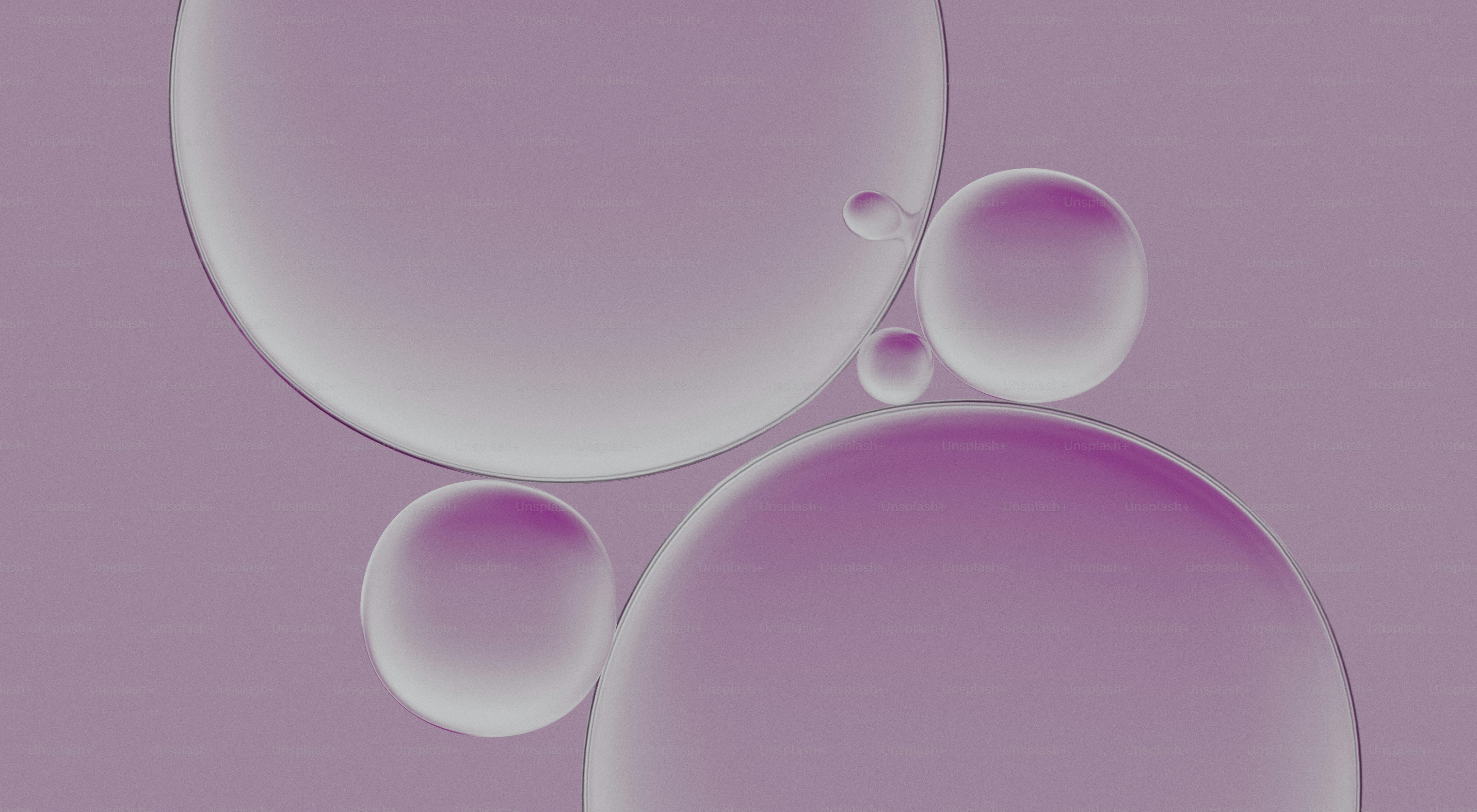 Several translucent purple spheres on a purple background.