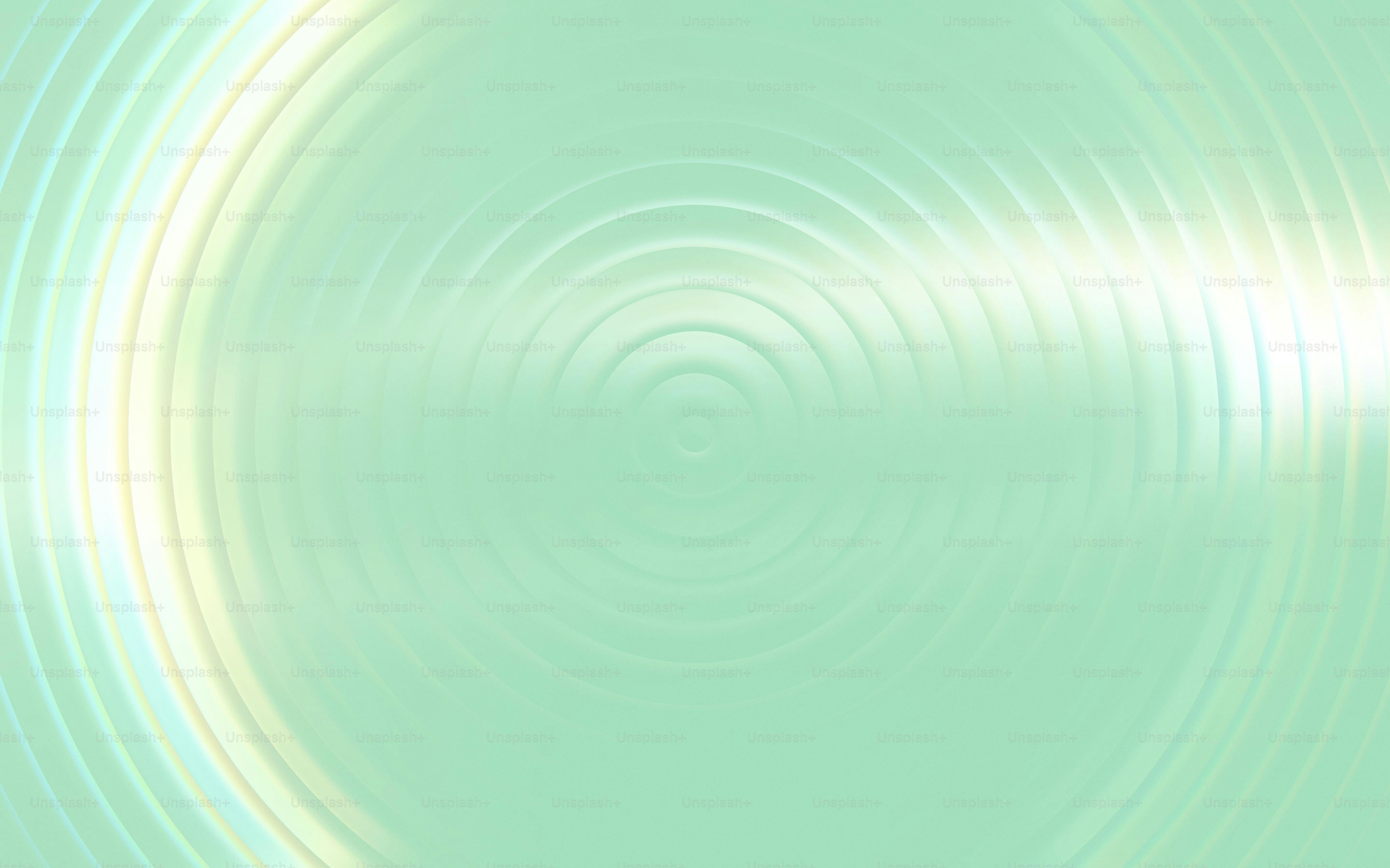 Concentric circles on a light green background.
