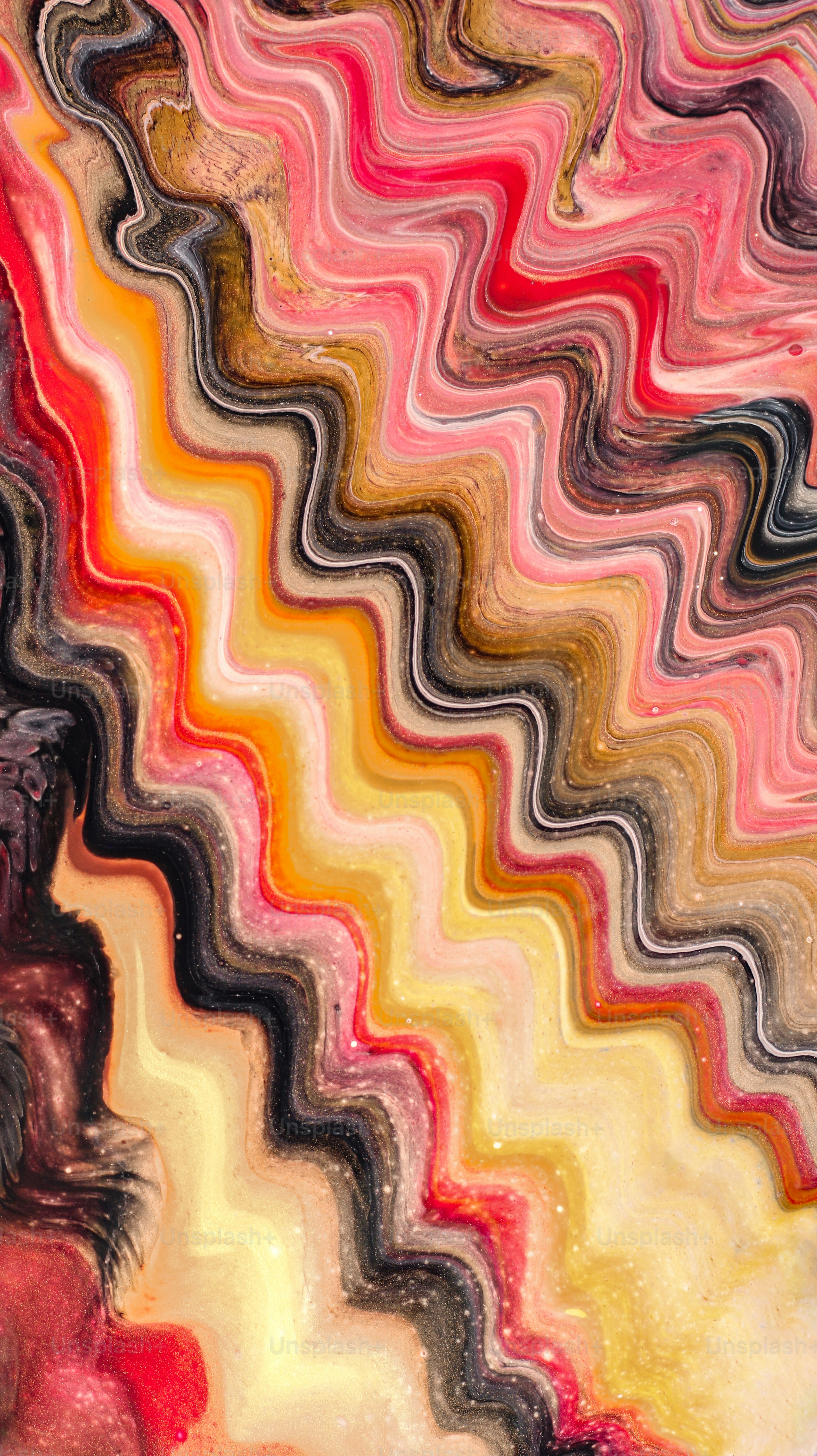 Abstract wavy pattern of pink, yellow, and black colors.