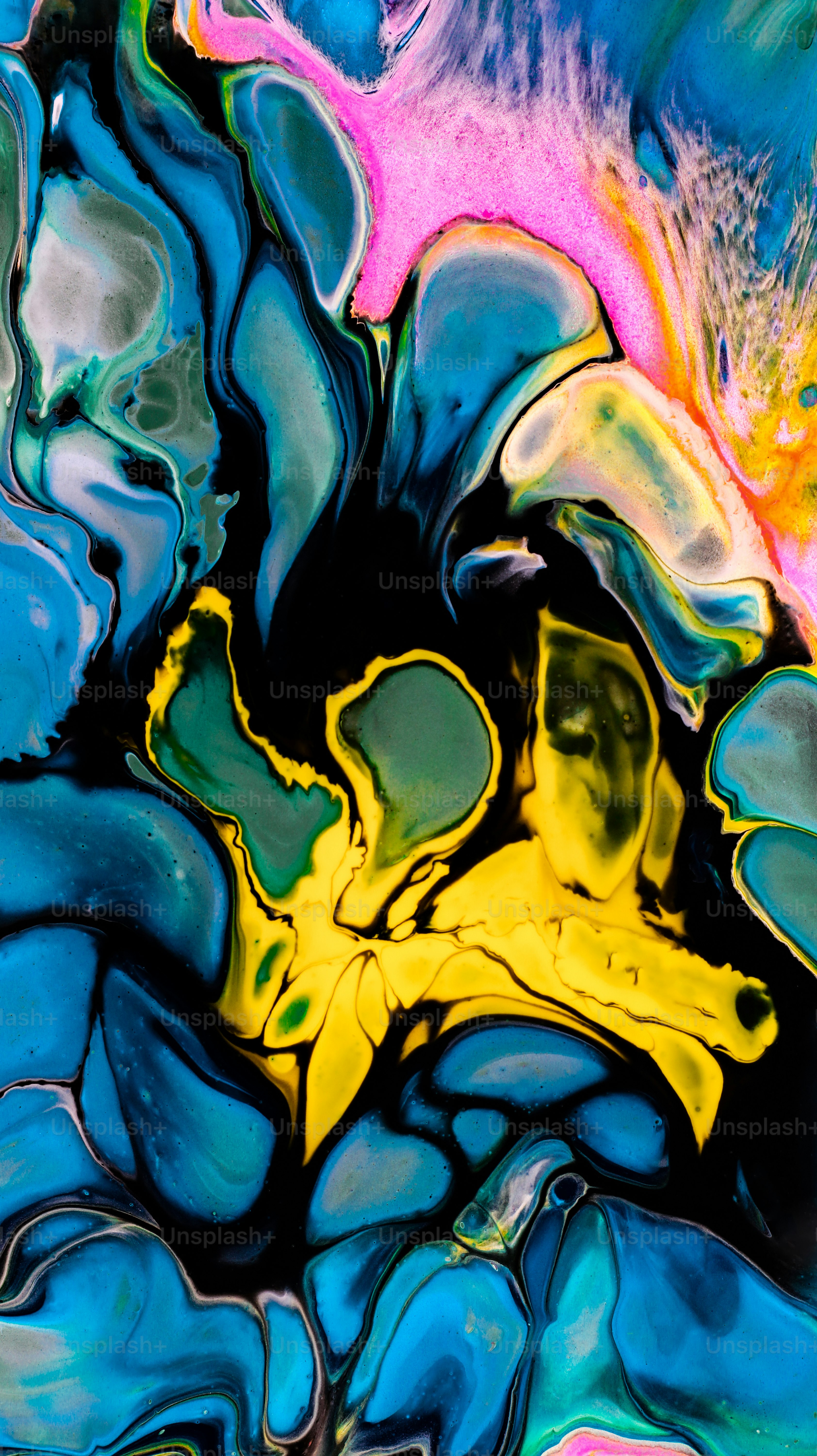 Abstract fluid art with blue, yellow, and pink swirls. photo ...
