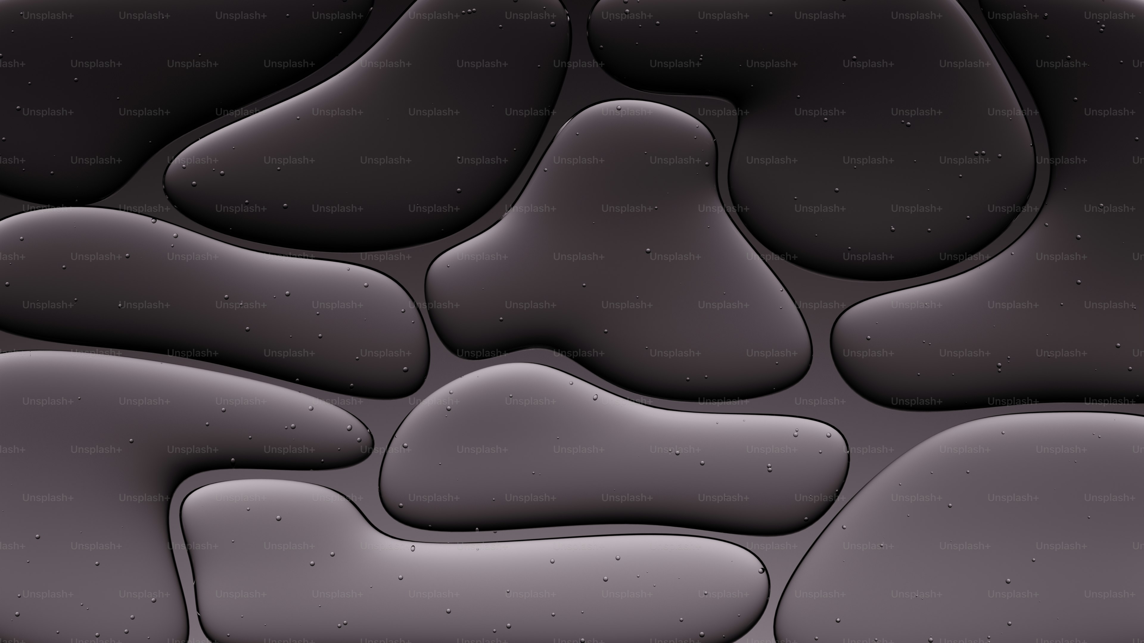 抽象的な暗灰色の有機的な形状で、微妙な質感があります。